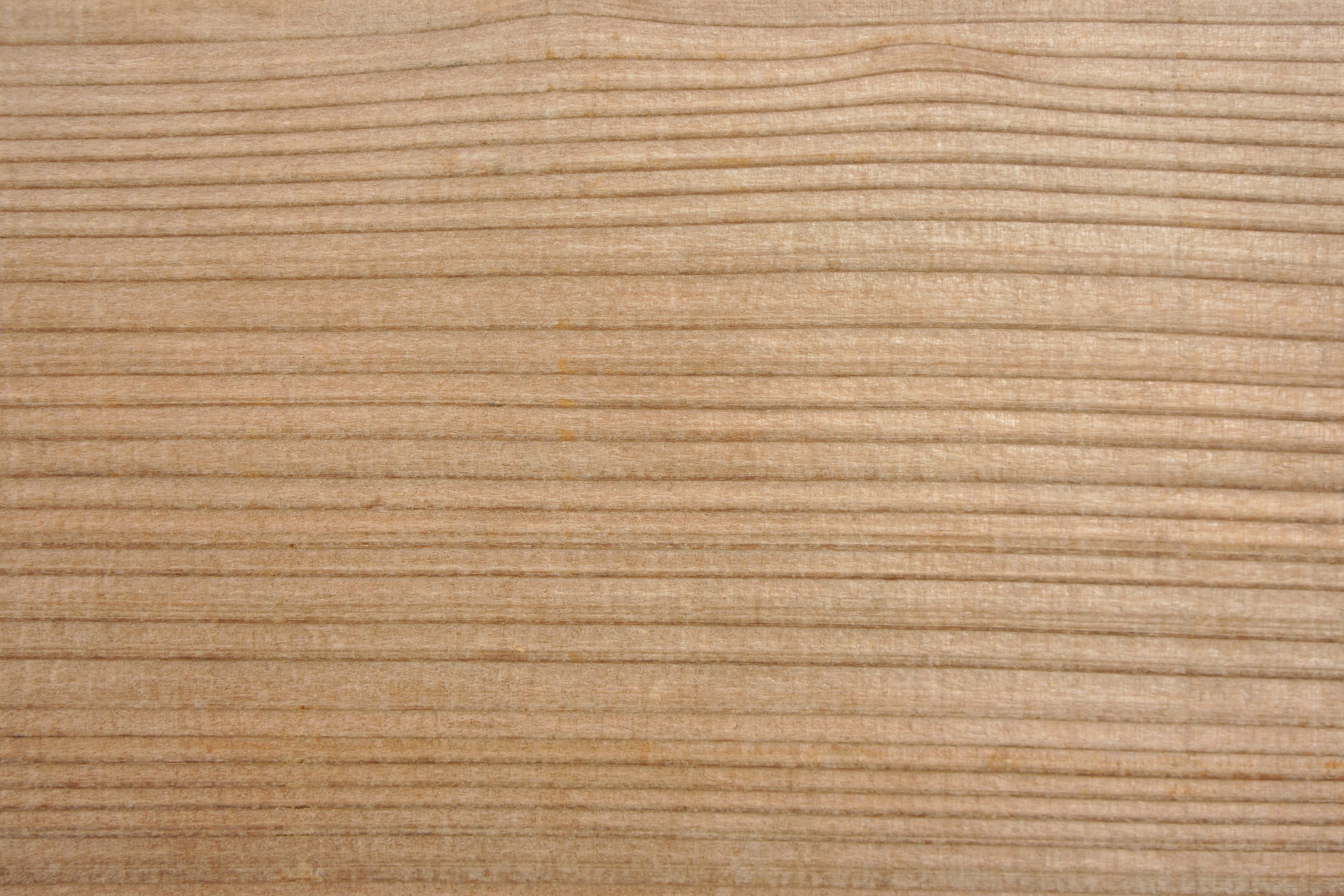 Texture de bois clair avec des motifs de grain visibles