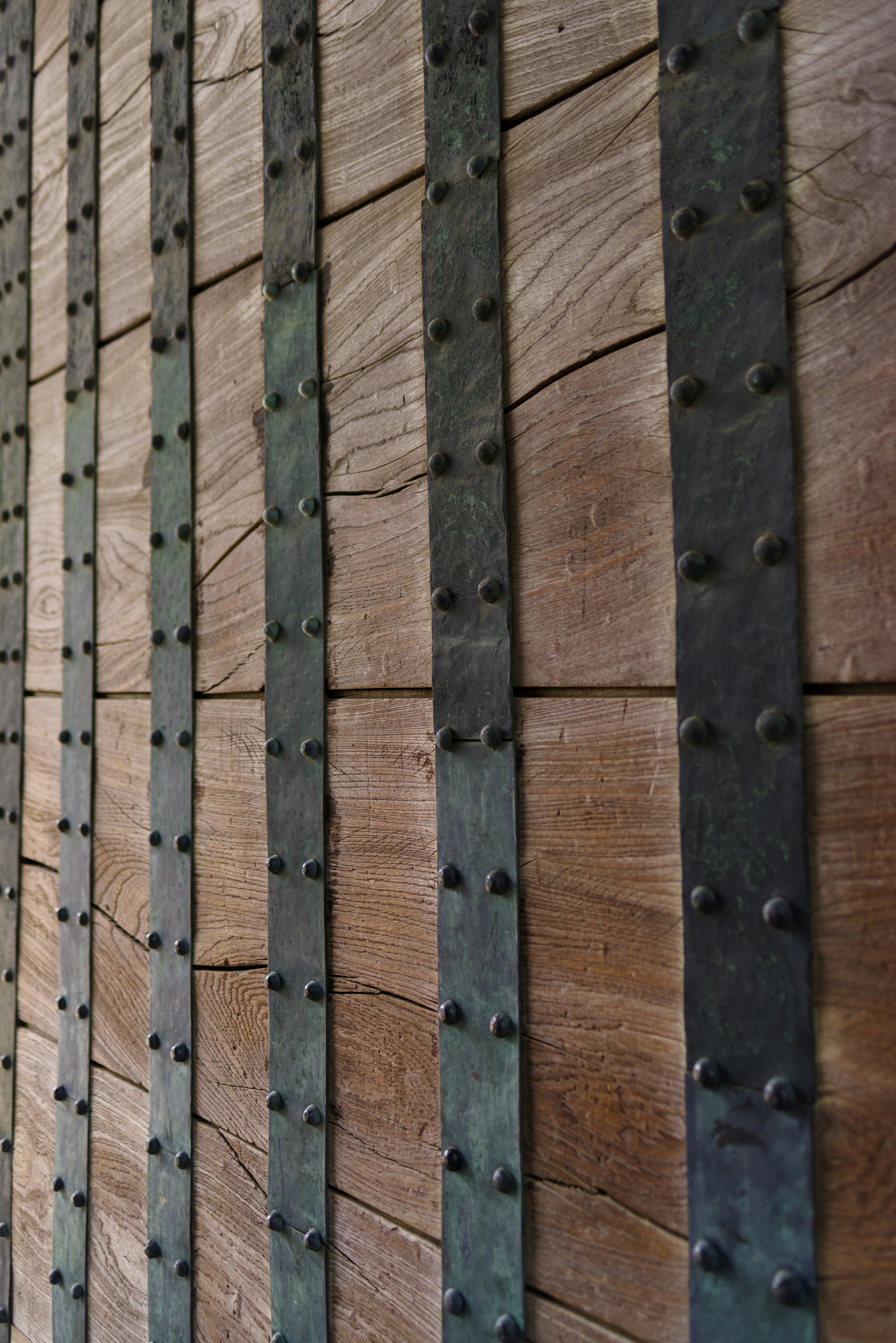 Close-up of a wooden wall with metal accents