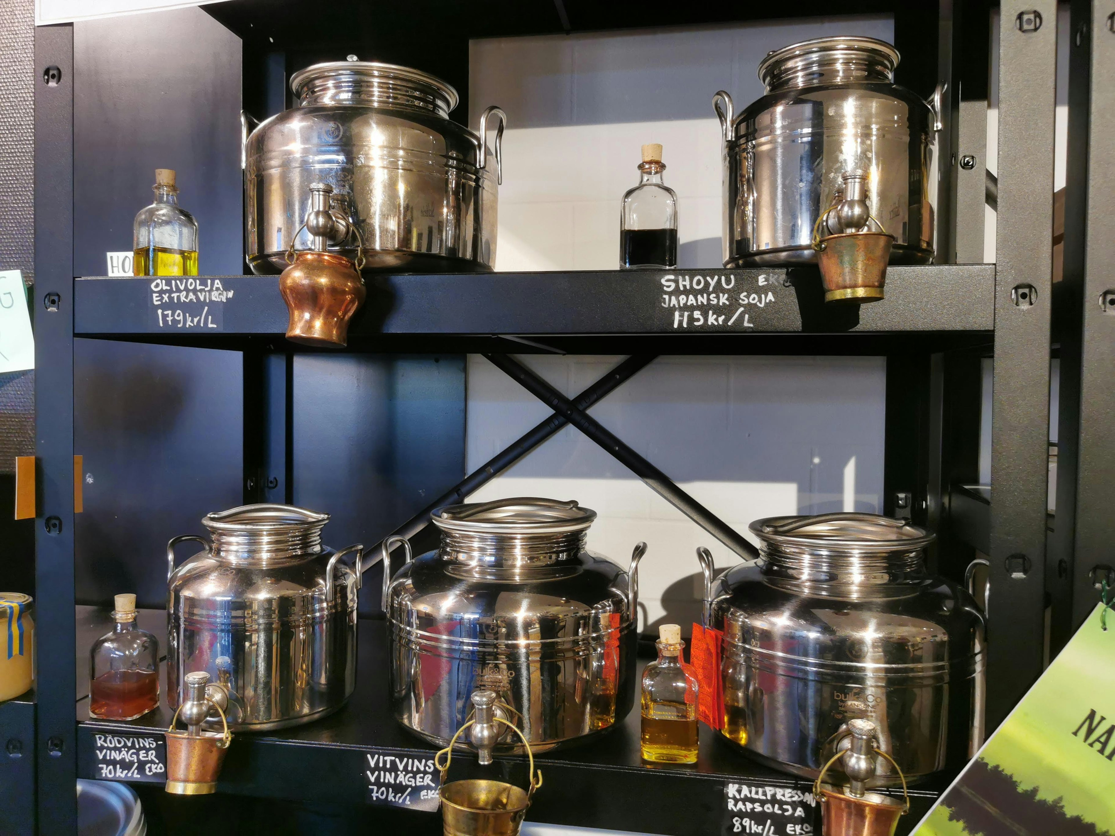 Image of a shelf displaying various metal containers