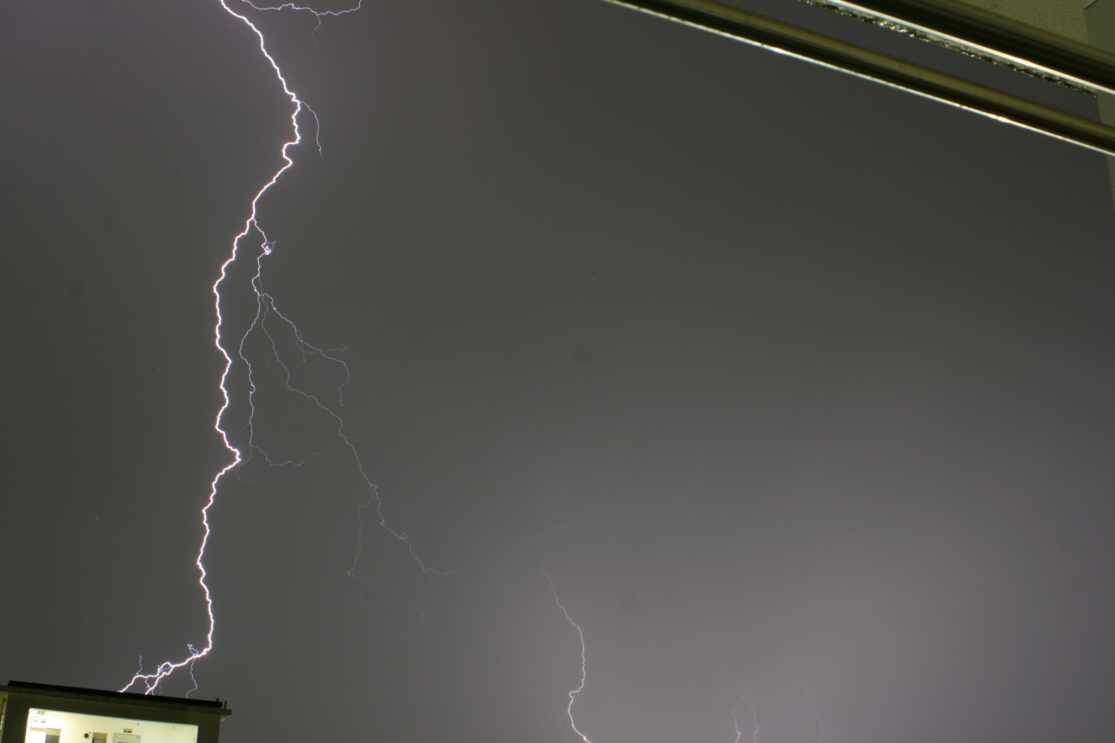 Lightning striking in a dark sky