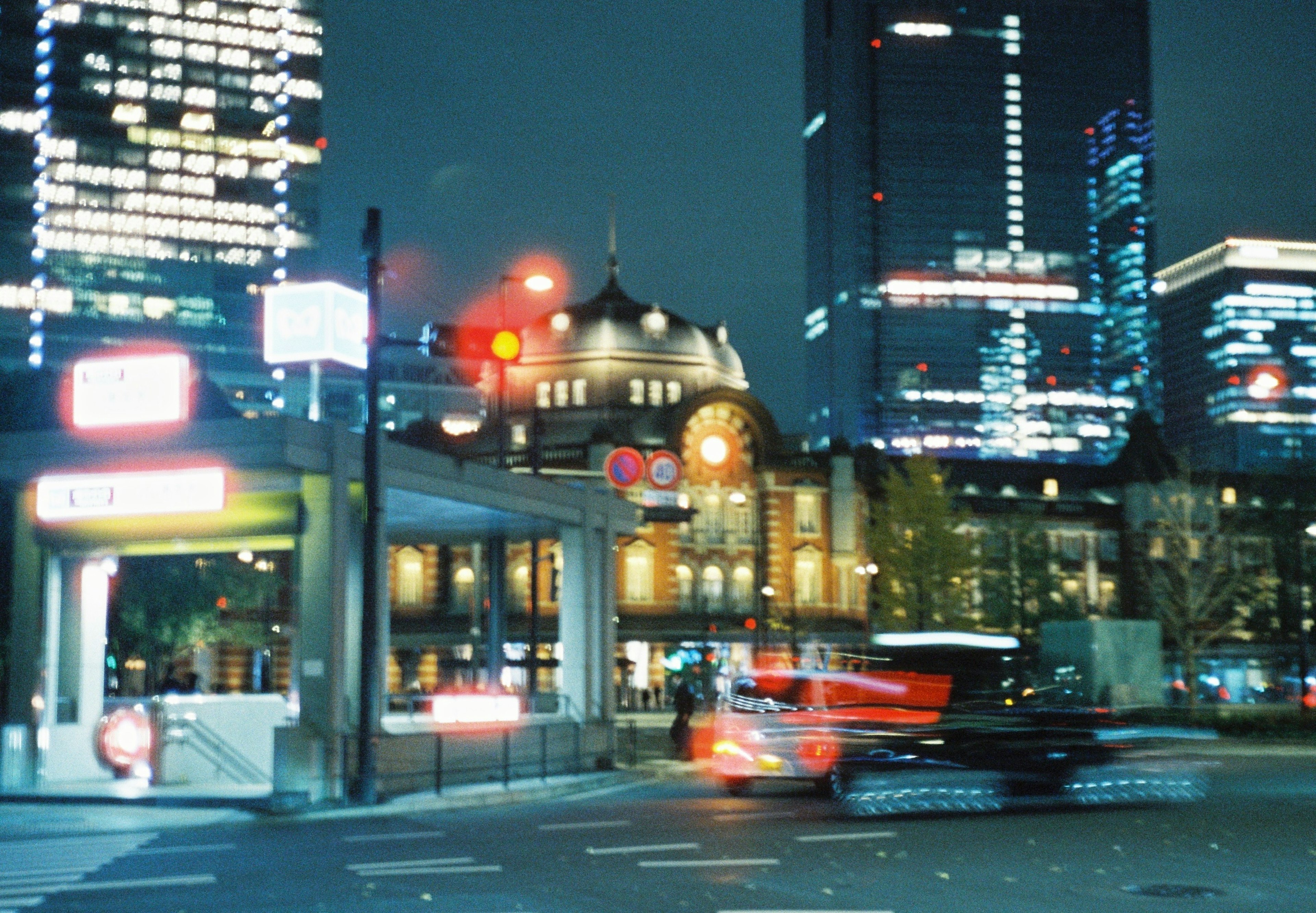 Night view of Tokyo Station with illuminated skyscrapers