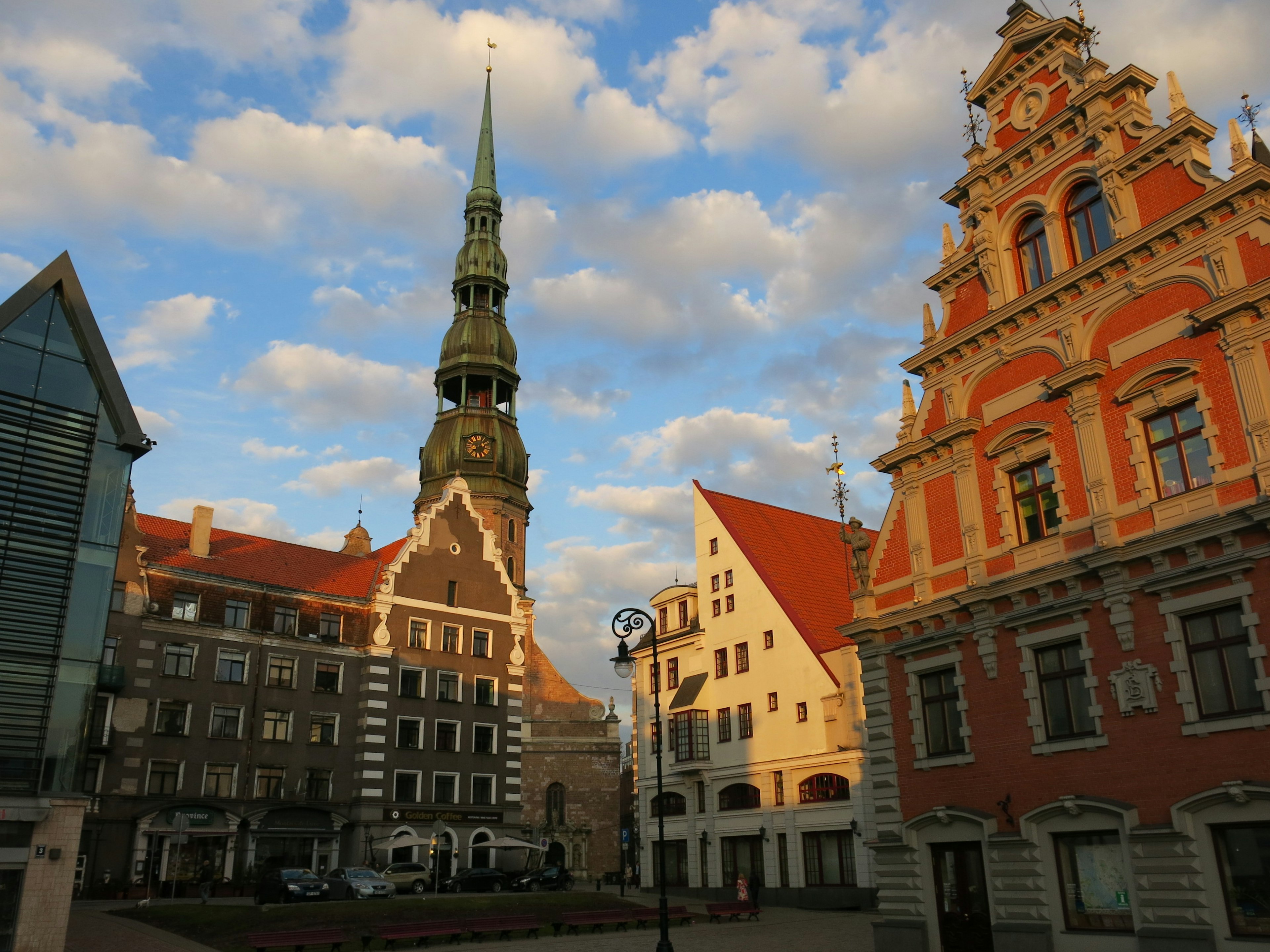 Historic buildings and tall spire in a beautiful square in Riga, Latvia