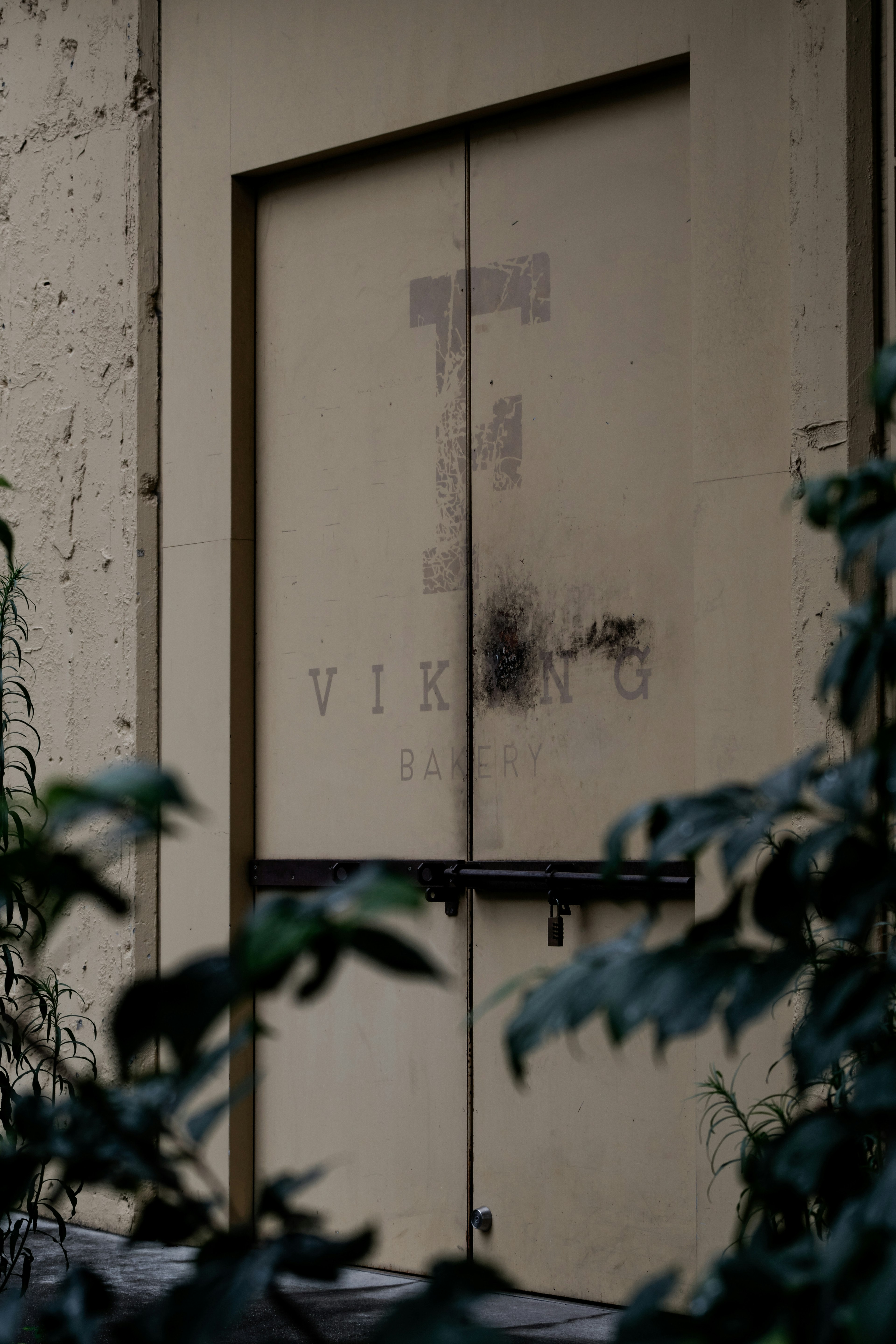 An old metal door featuring the word 'VIKING' partially visible