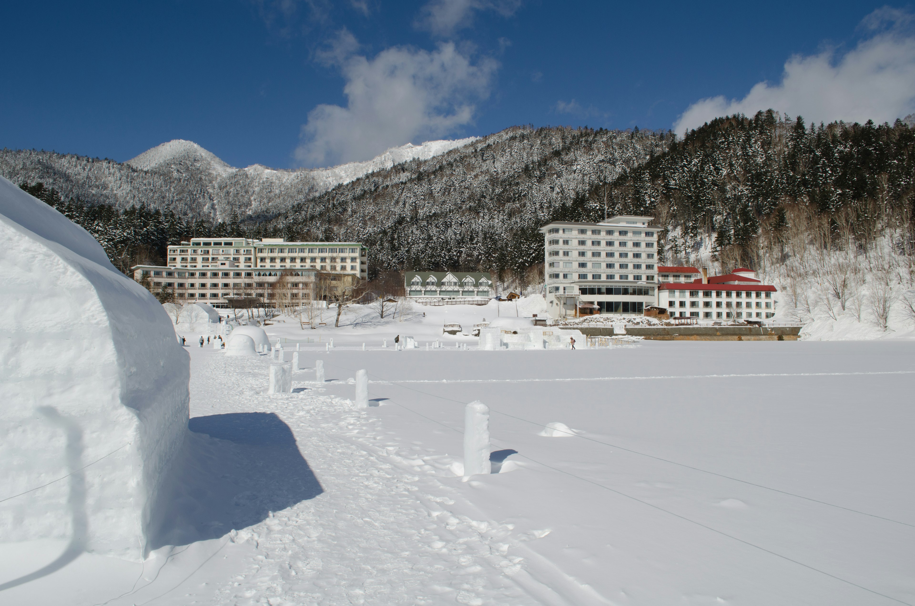 Winter landscape featuring snow-covered mountains and hotels