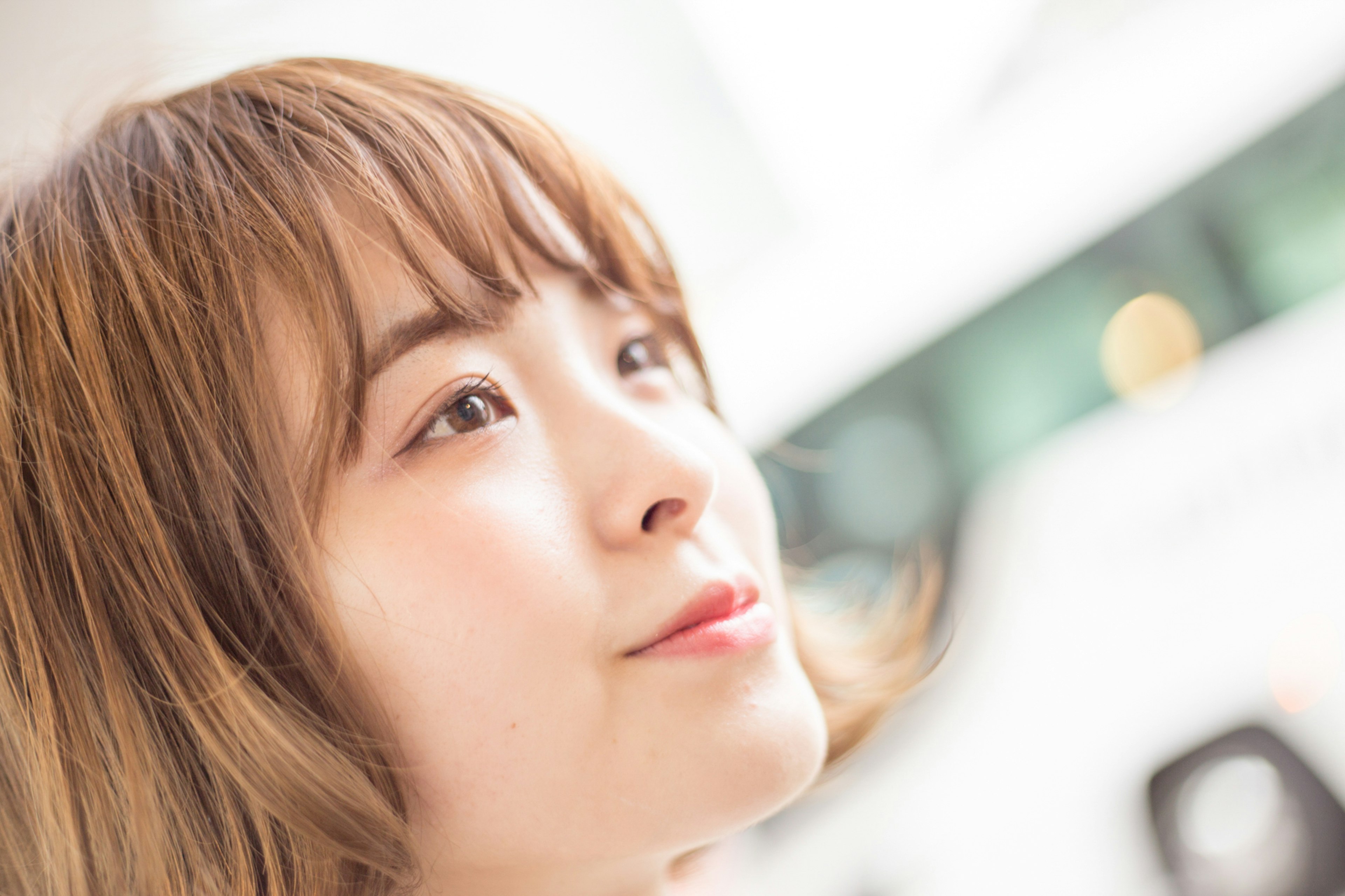 Woman's profile softly smiling in gentle light