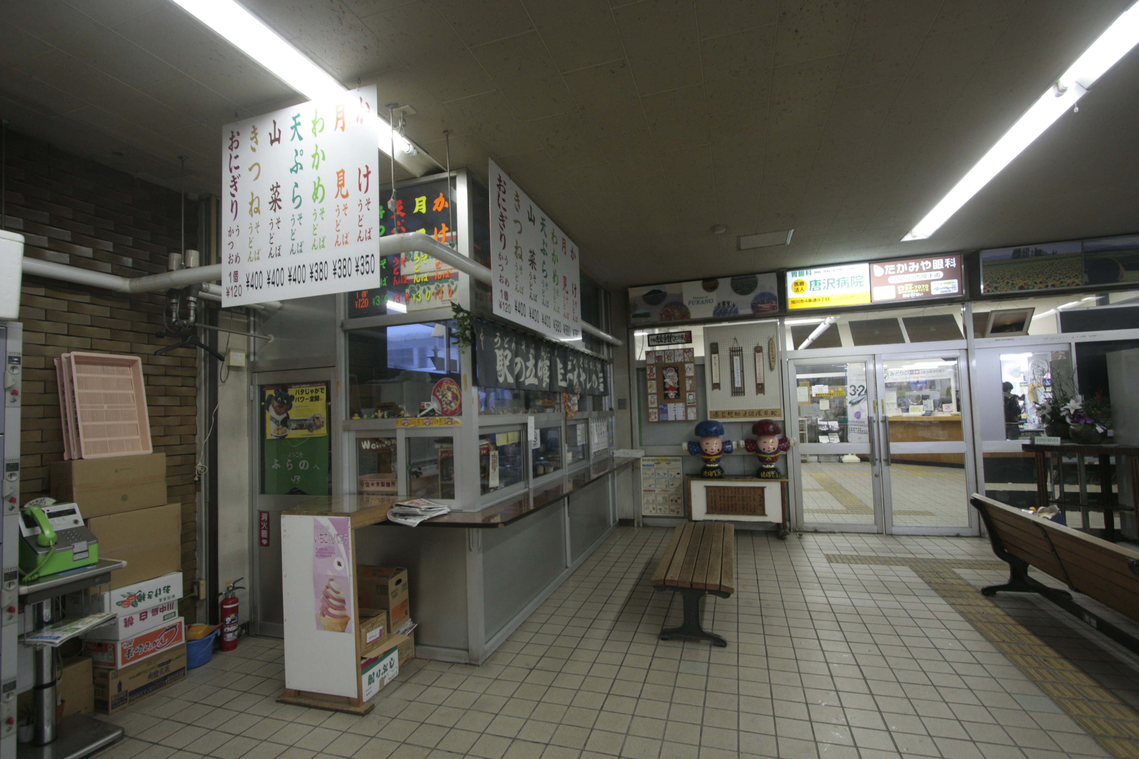 Interior of a food stall in a train station waiting area Spacious layout with displayed menus