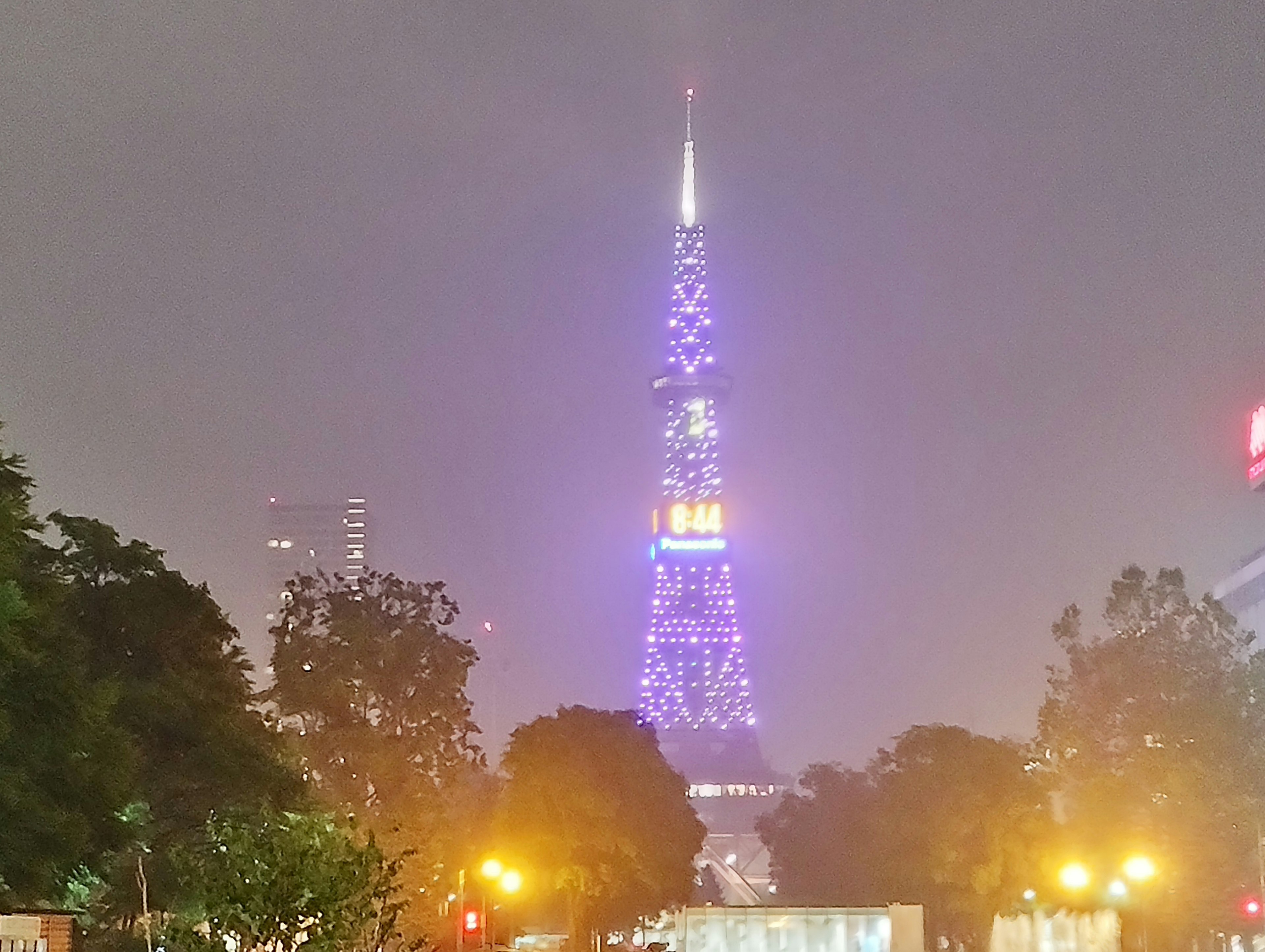 Tokyo Tower illuminated in purple at night