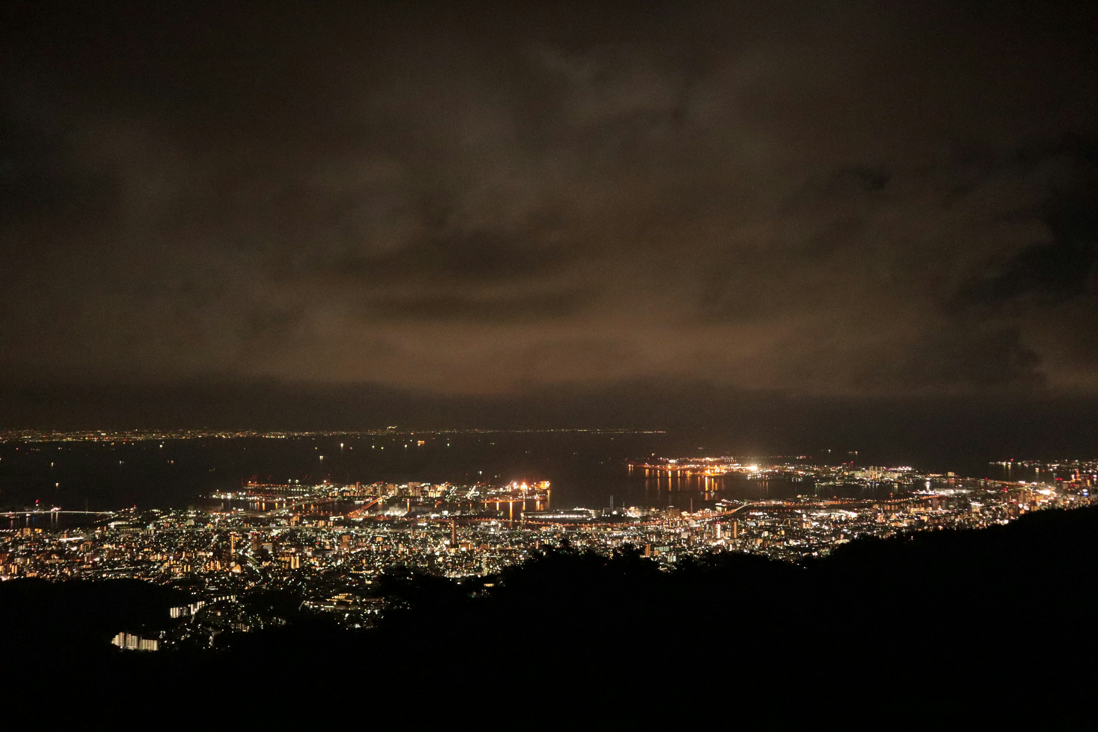 A panoramic view of a city illuminated at night