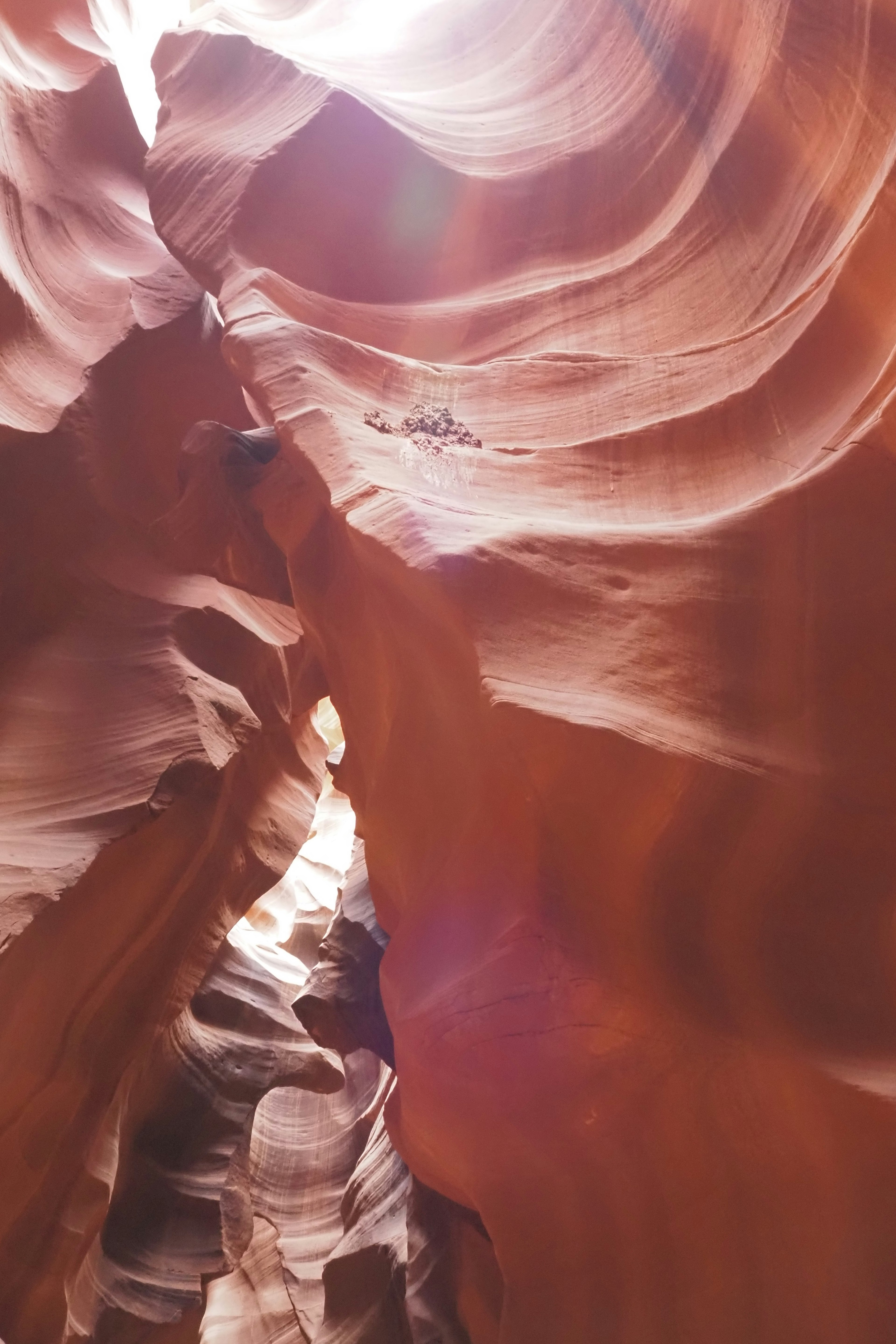 Antelope Canyon with red rock walls and light streaming through