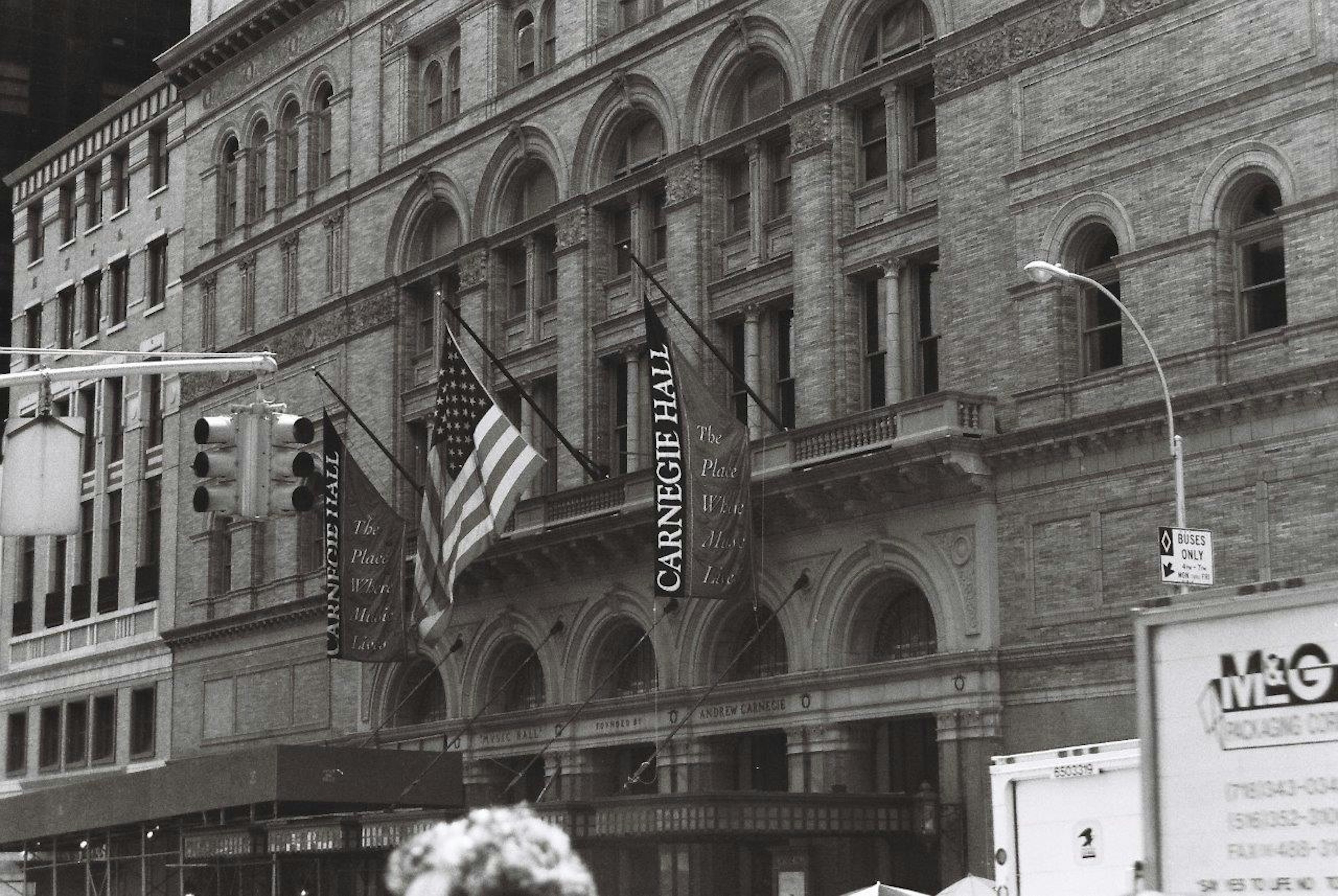 Exterior of Carnegie Hall with American flags