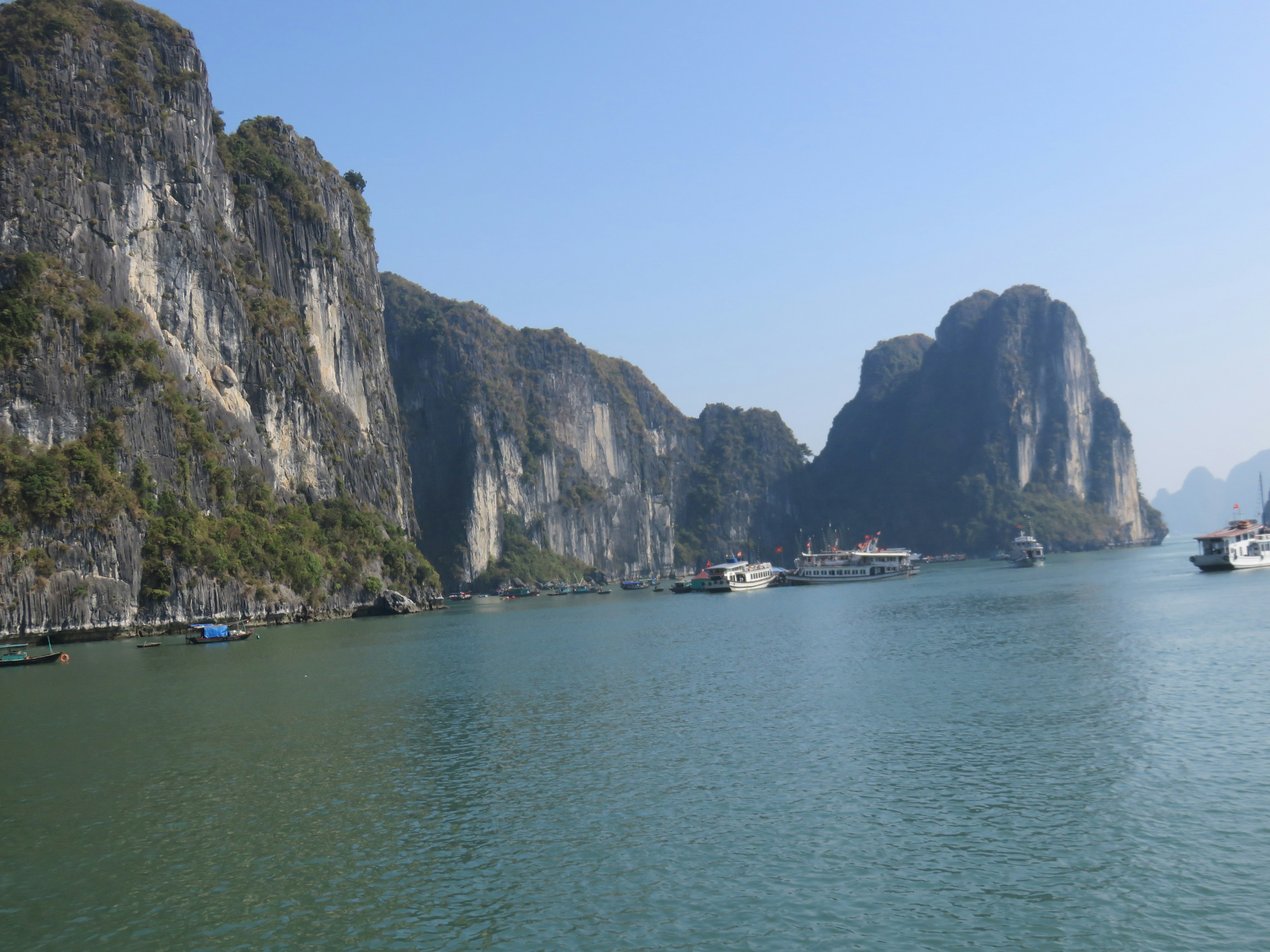 Scenic view of blue water and majestic limestone mountains