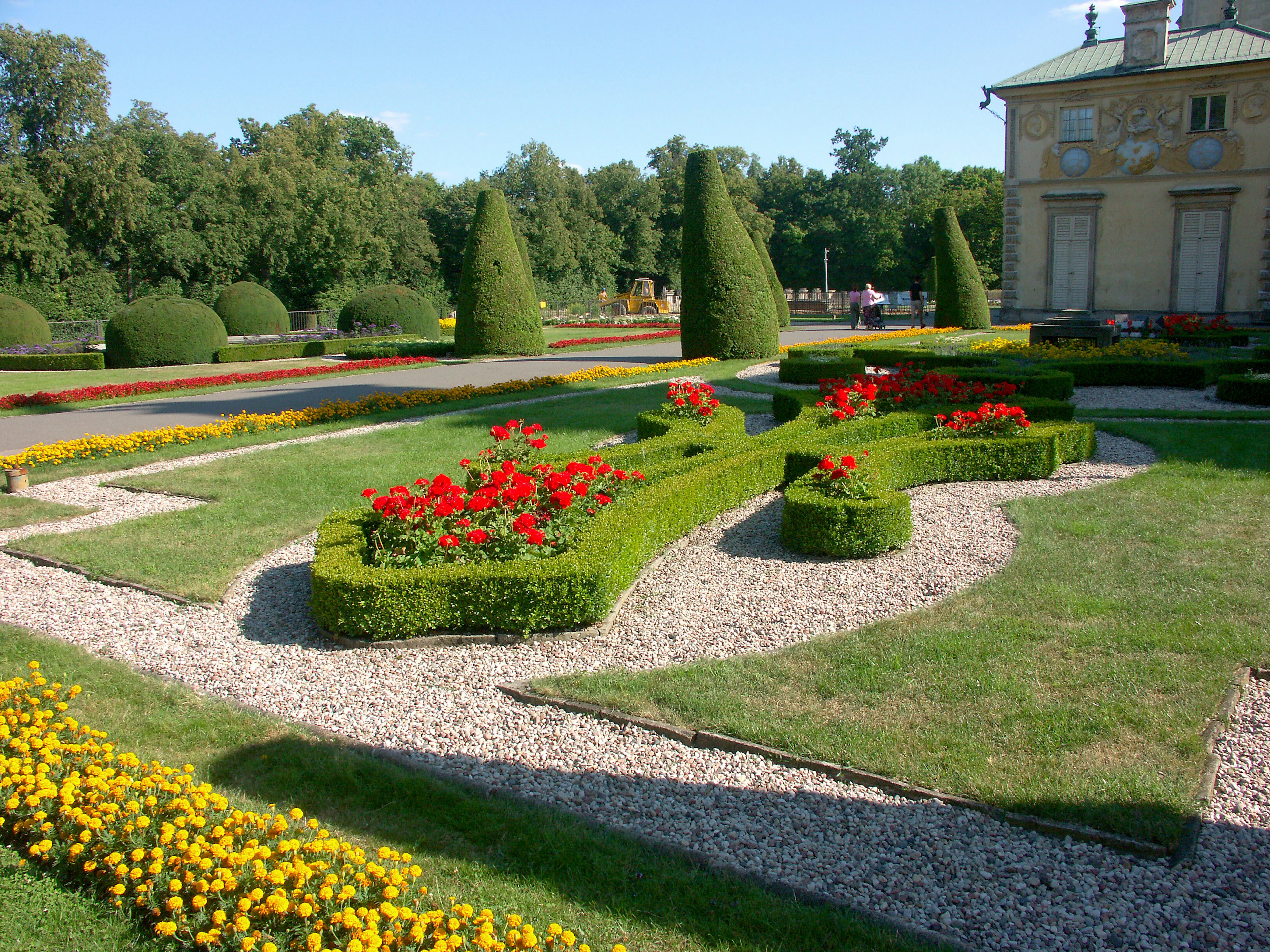 Beautiful garden design featuring colorful flowers and neatly trimmed hedges