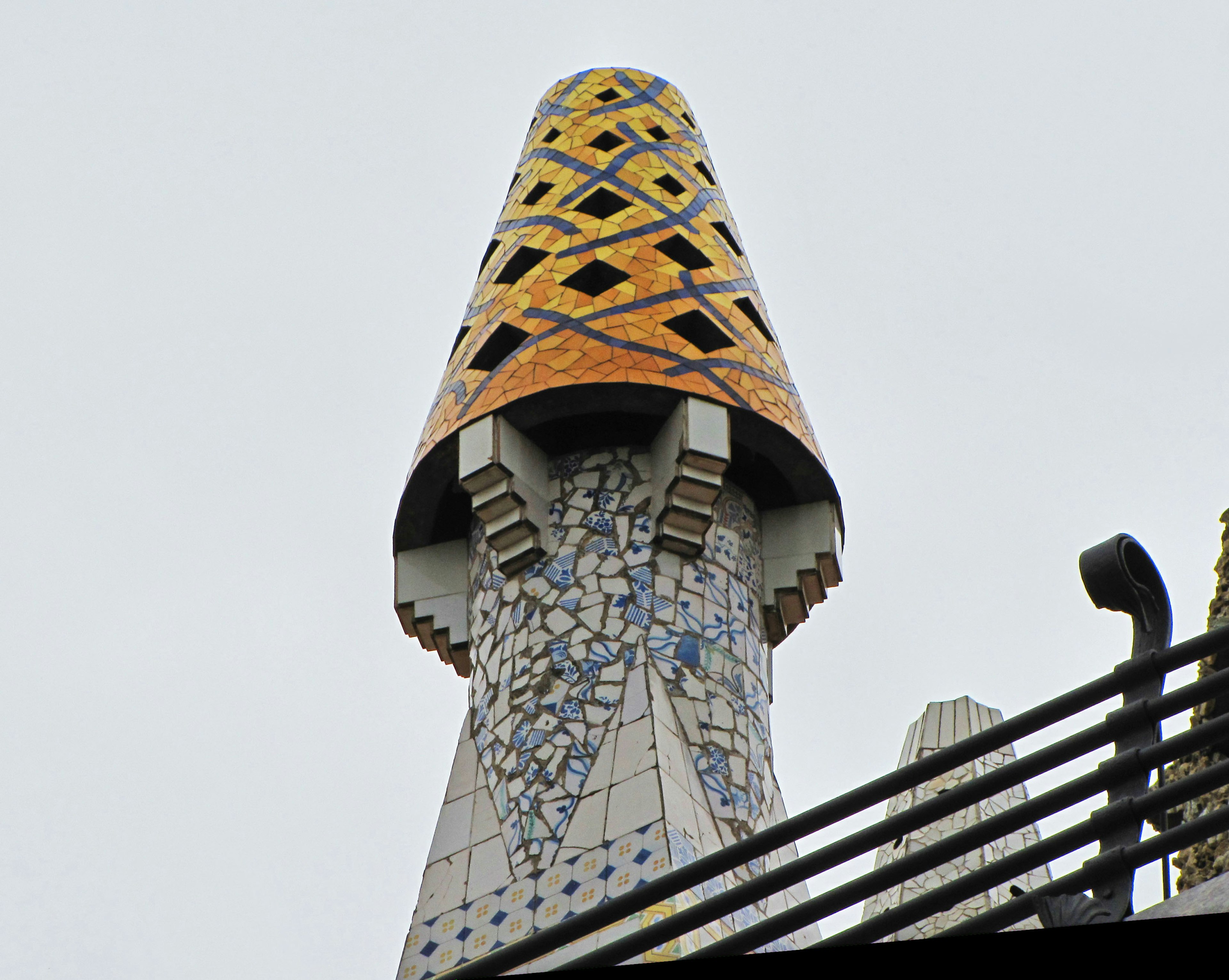 Unique tower tip of Casa Mila in Barcelona adorned with colorful tiles