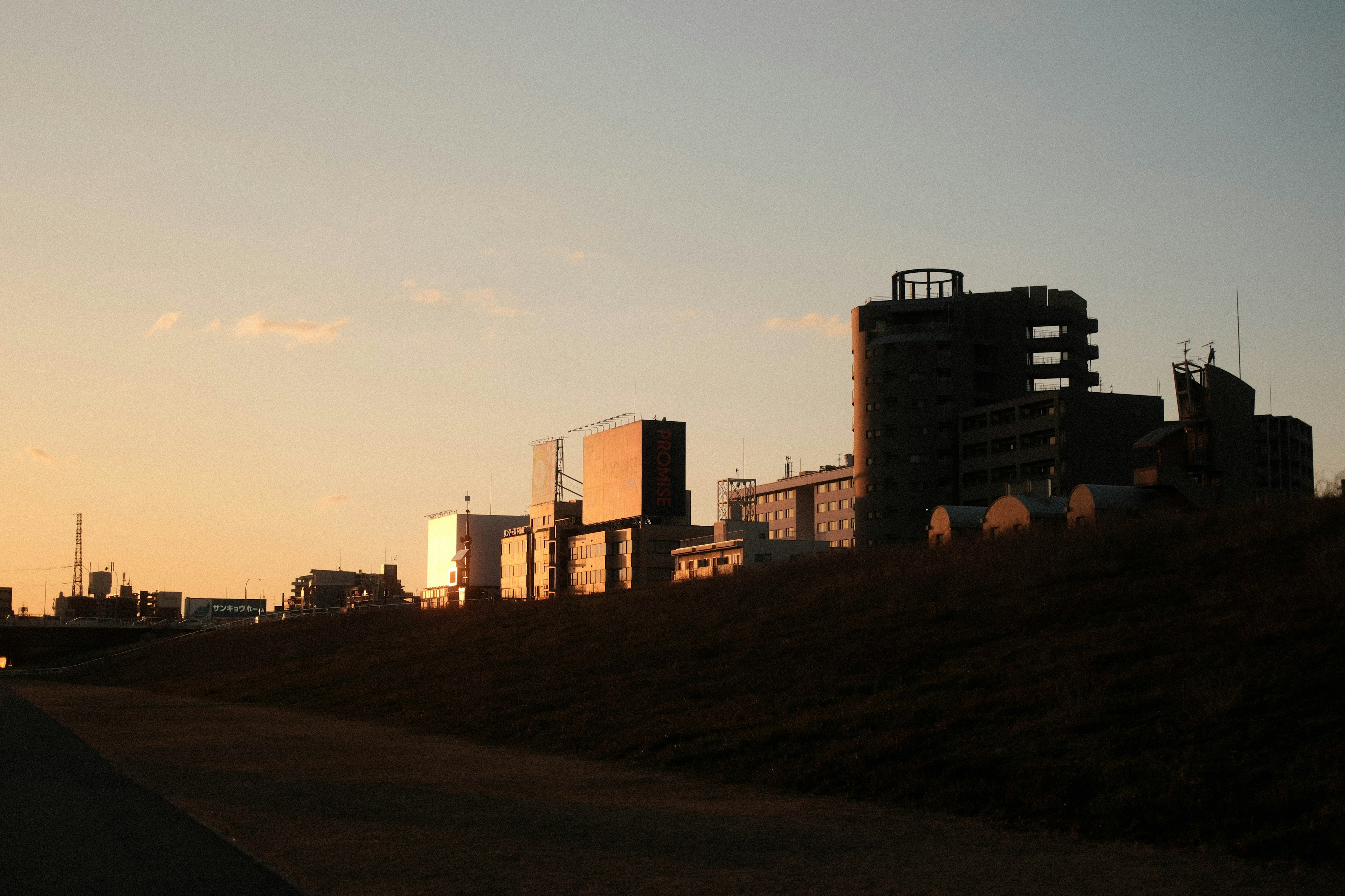 Silhouette of buildings illuminated by sunset