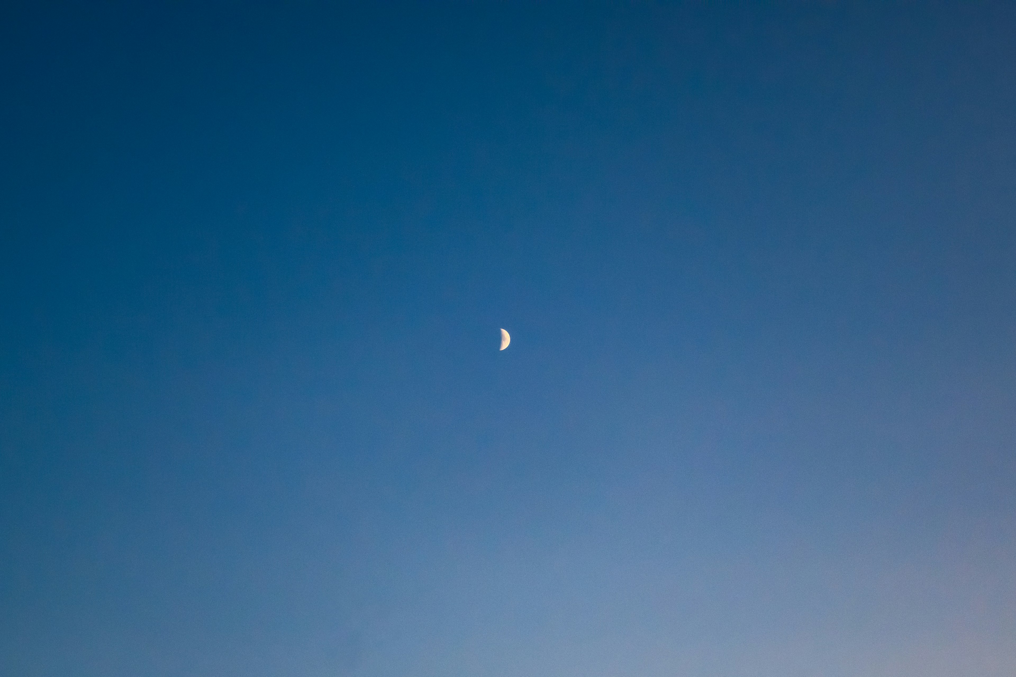 Crescent moon in a blue sky