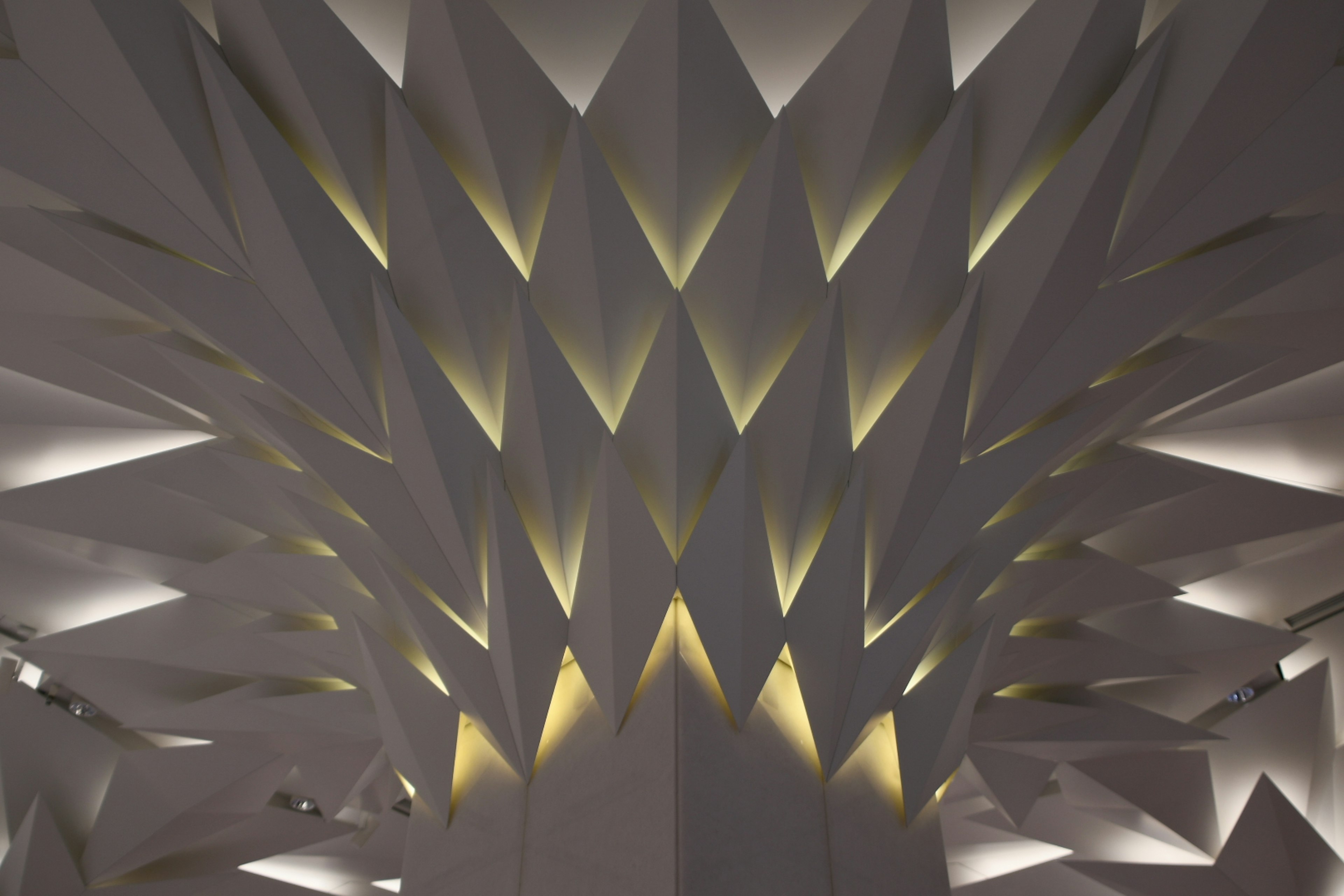 Geometric white wall with distinctive lighting design