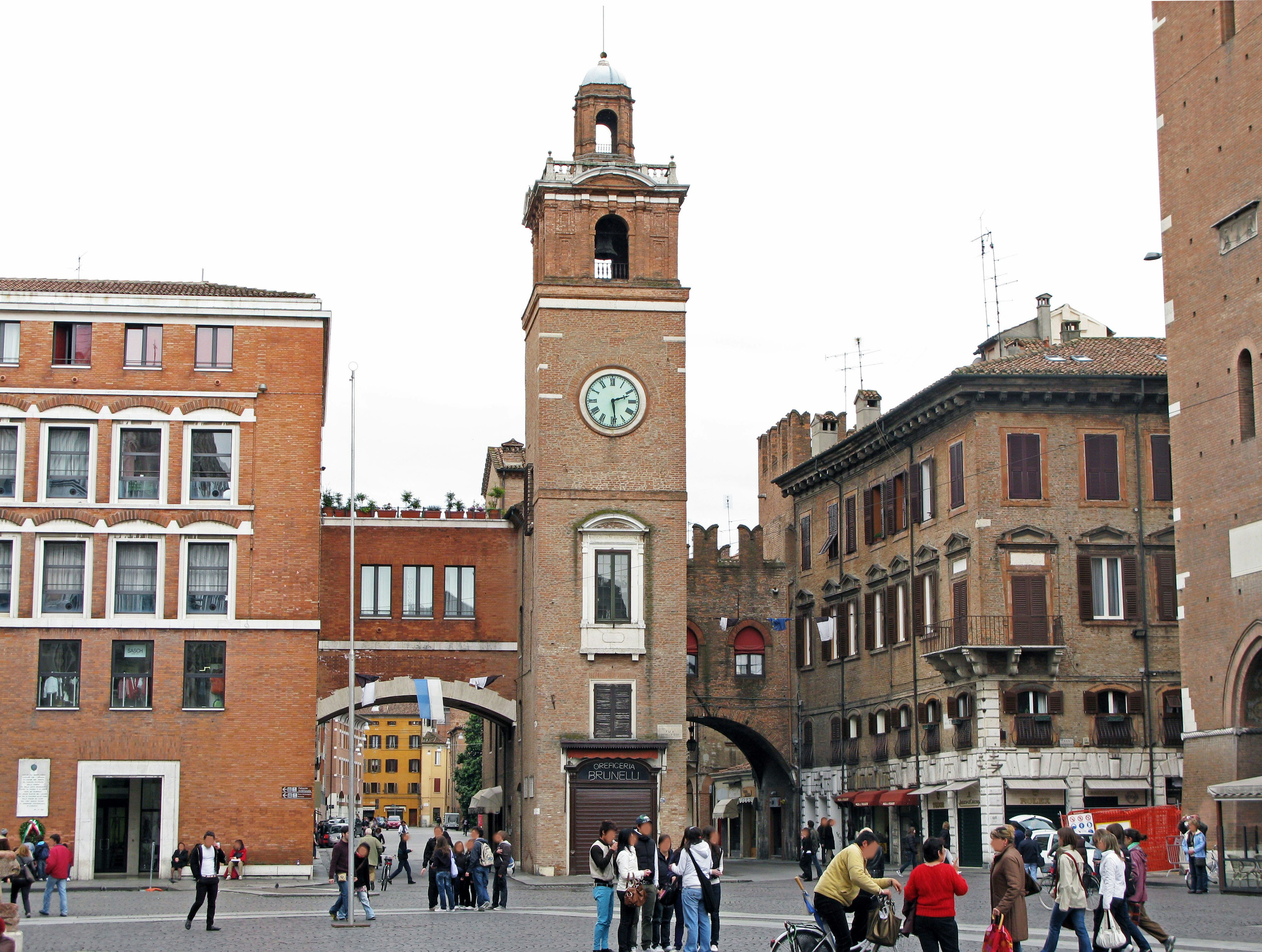 Clock tower and historic buildings in a Roman square