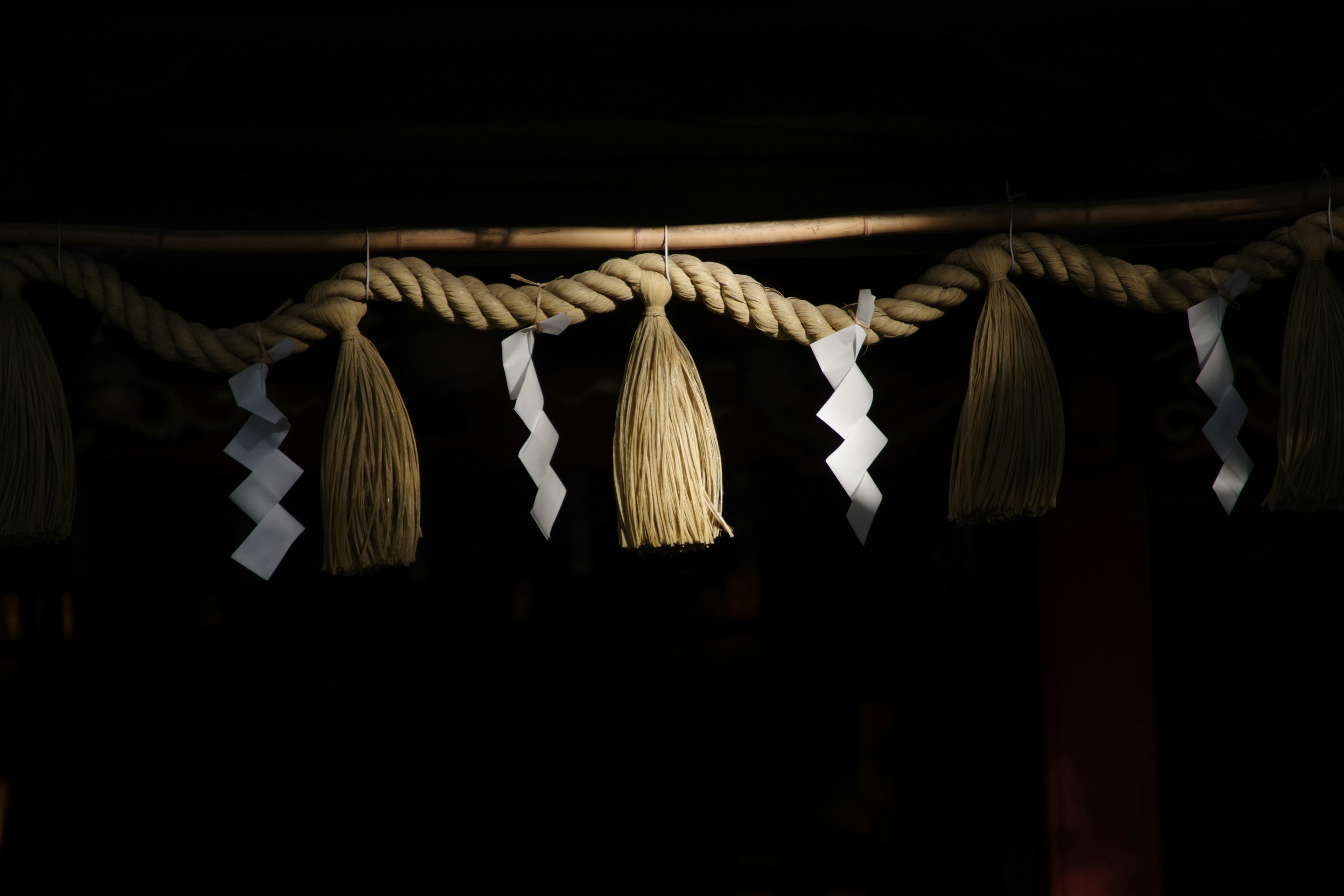 Decorative display of rope and white ornaments hanging