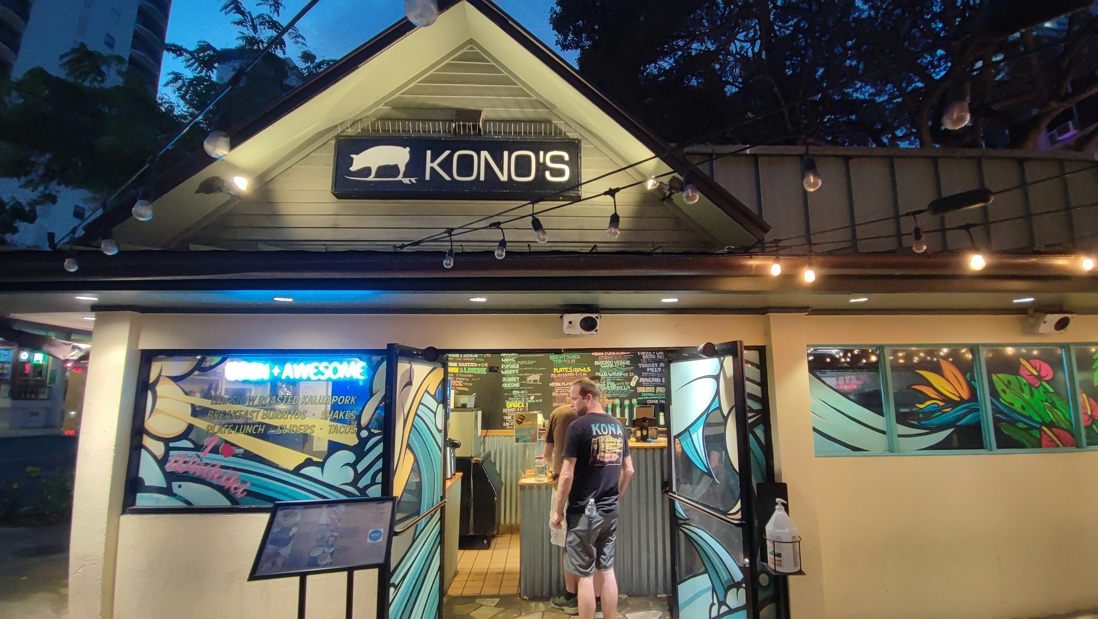 Exterior of Kono's with a person entering at night