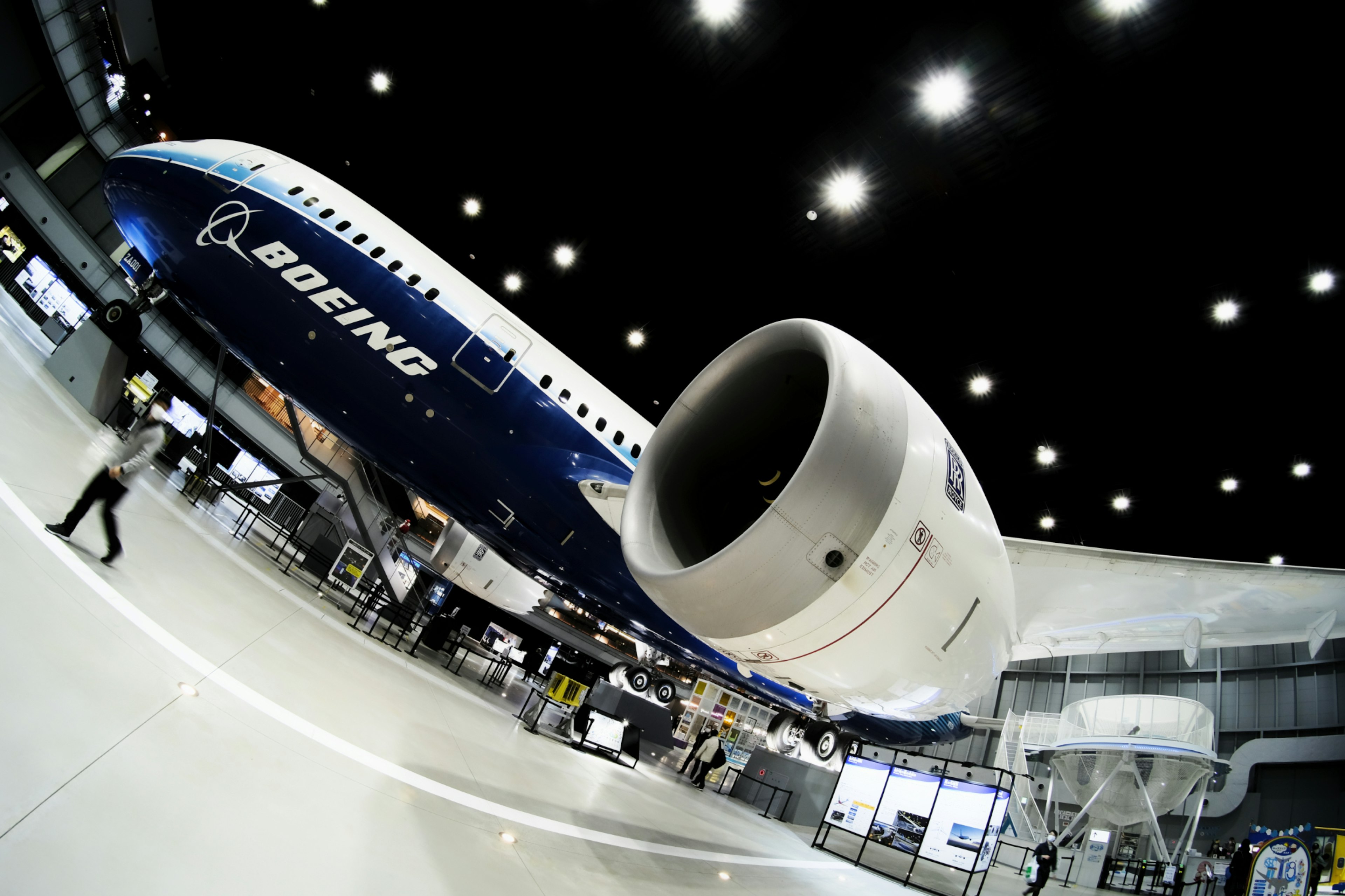 Boeing passenger aircraft displayed in an airport interior