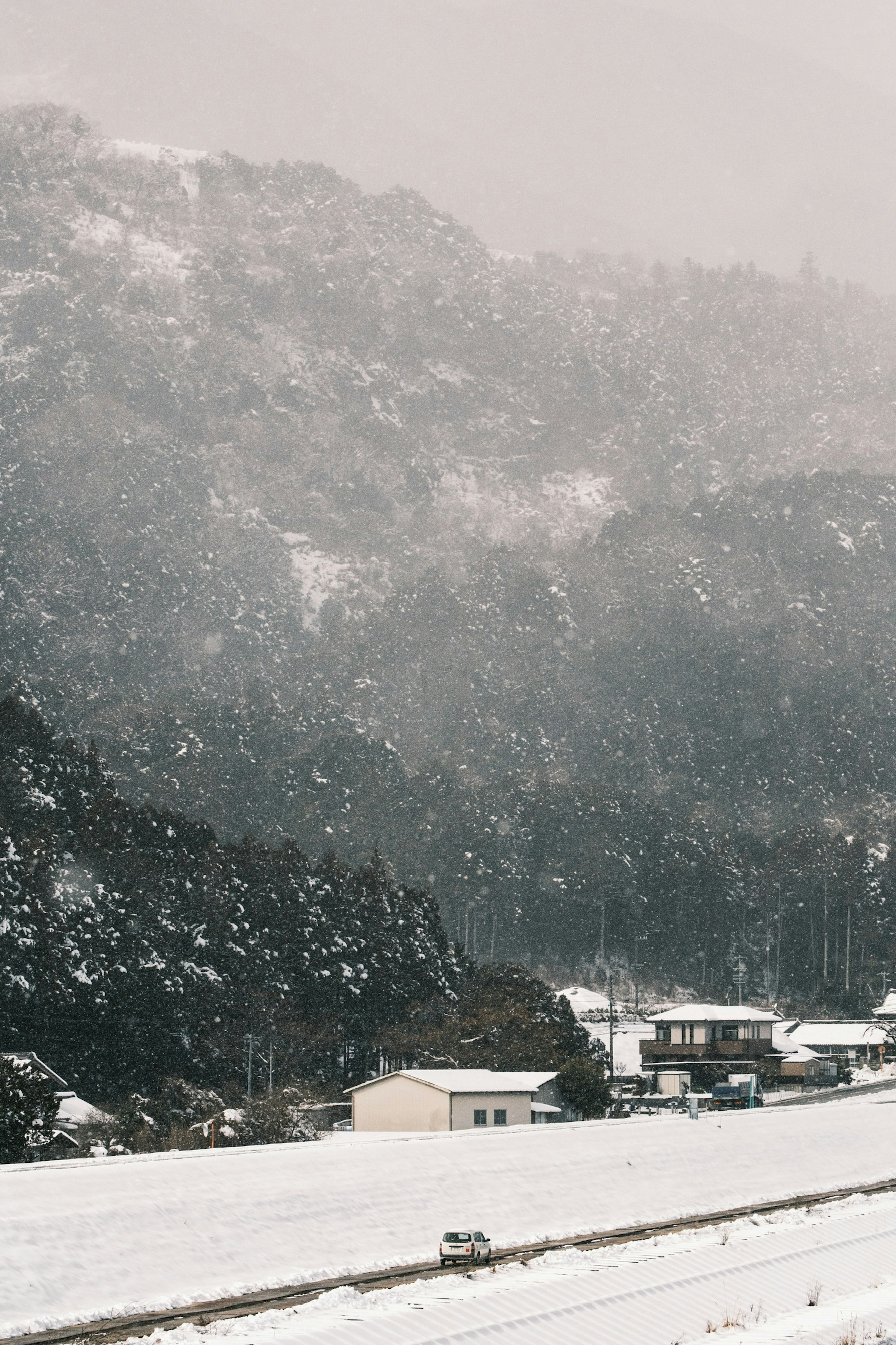 Snow-covered mountain and village landscape