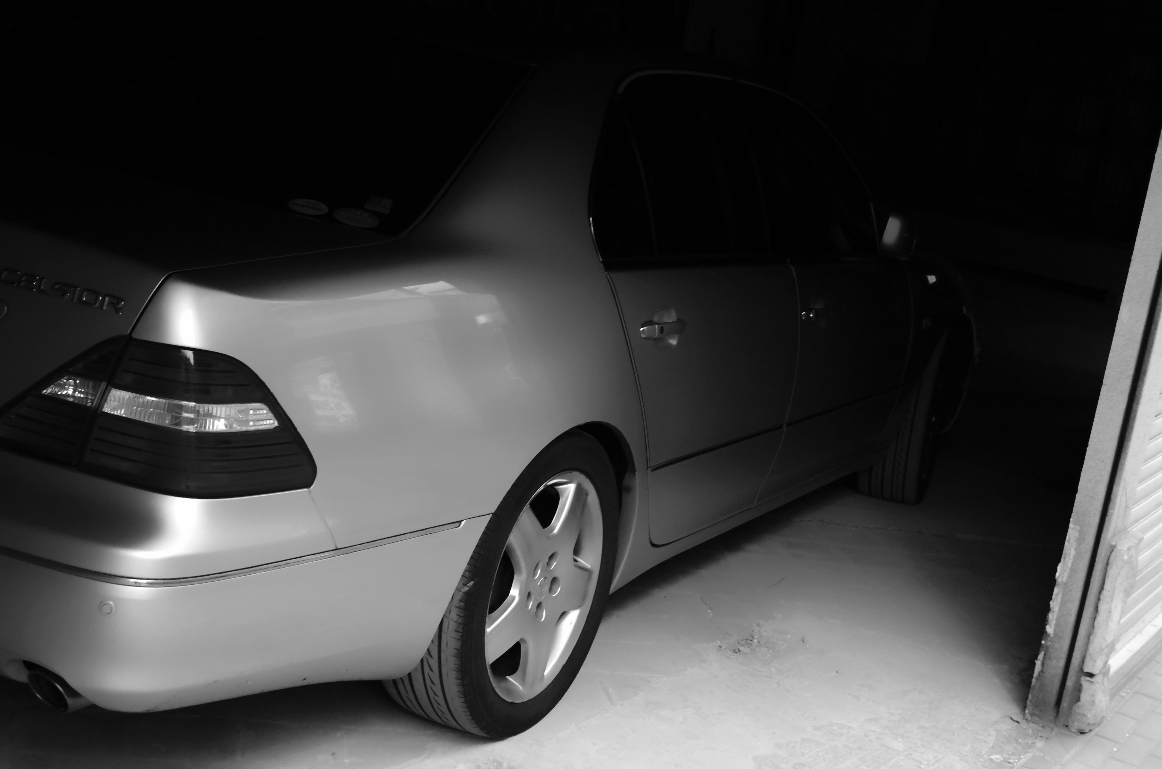 Silver car parked in a dark garage