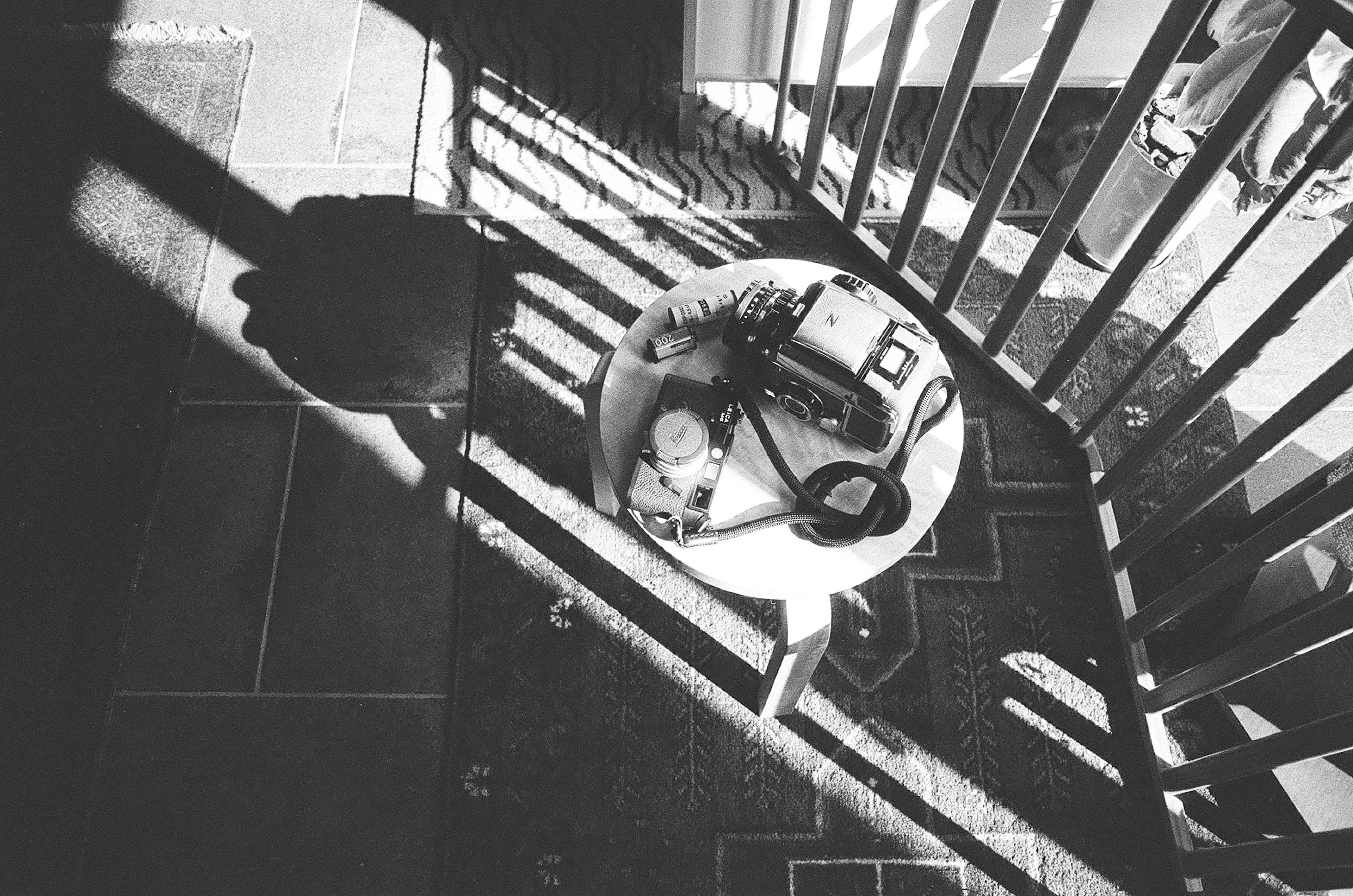 Items on a chair in black and white contrast with shadows