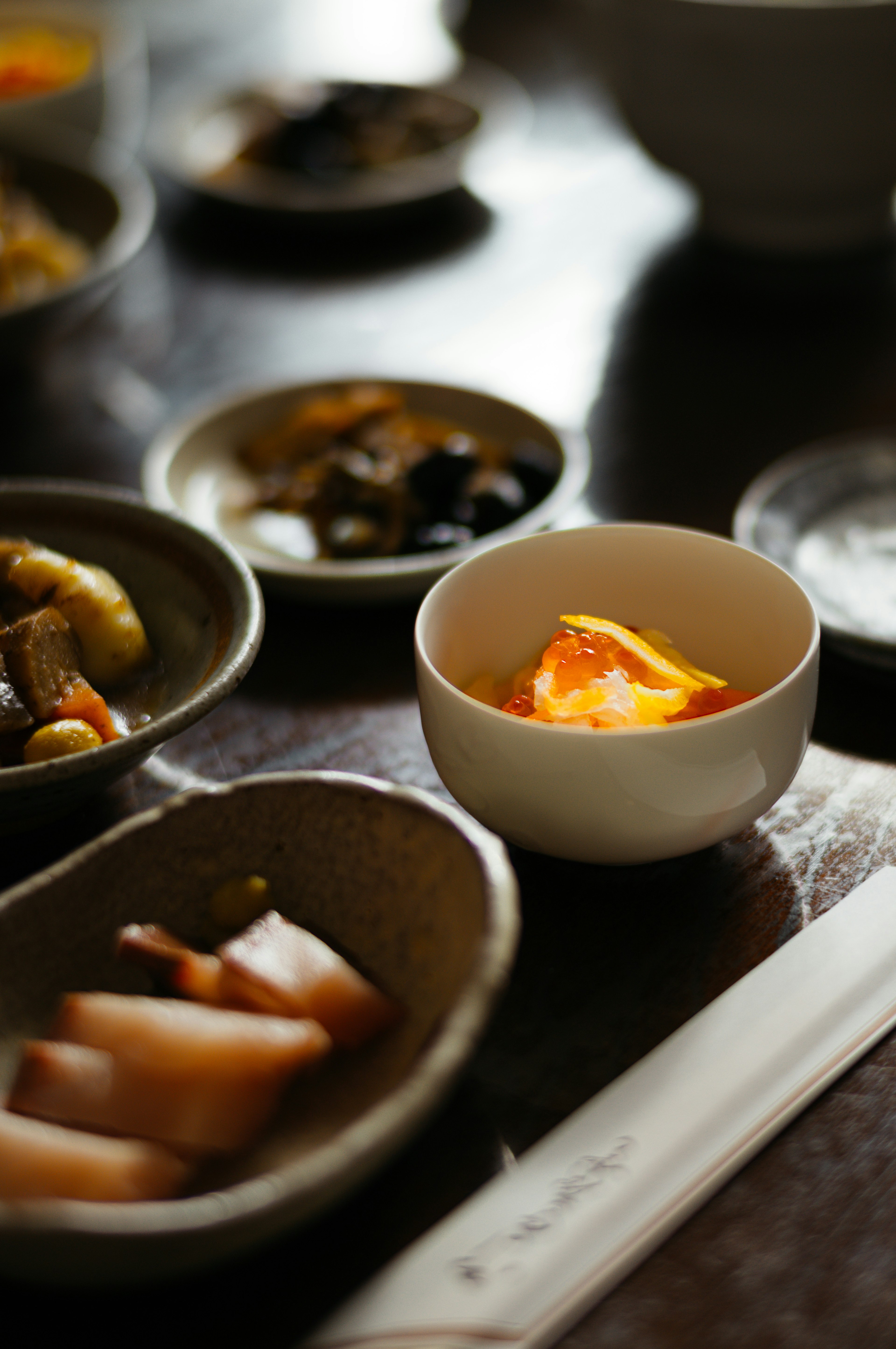 A beautifully arranged table setting featuring traditional Japanese cuisine