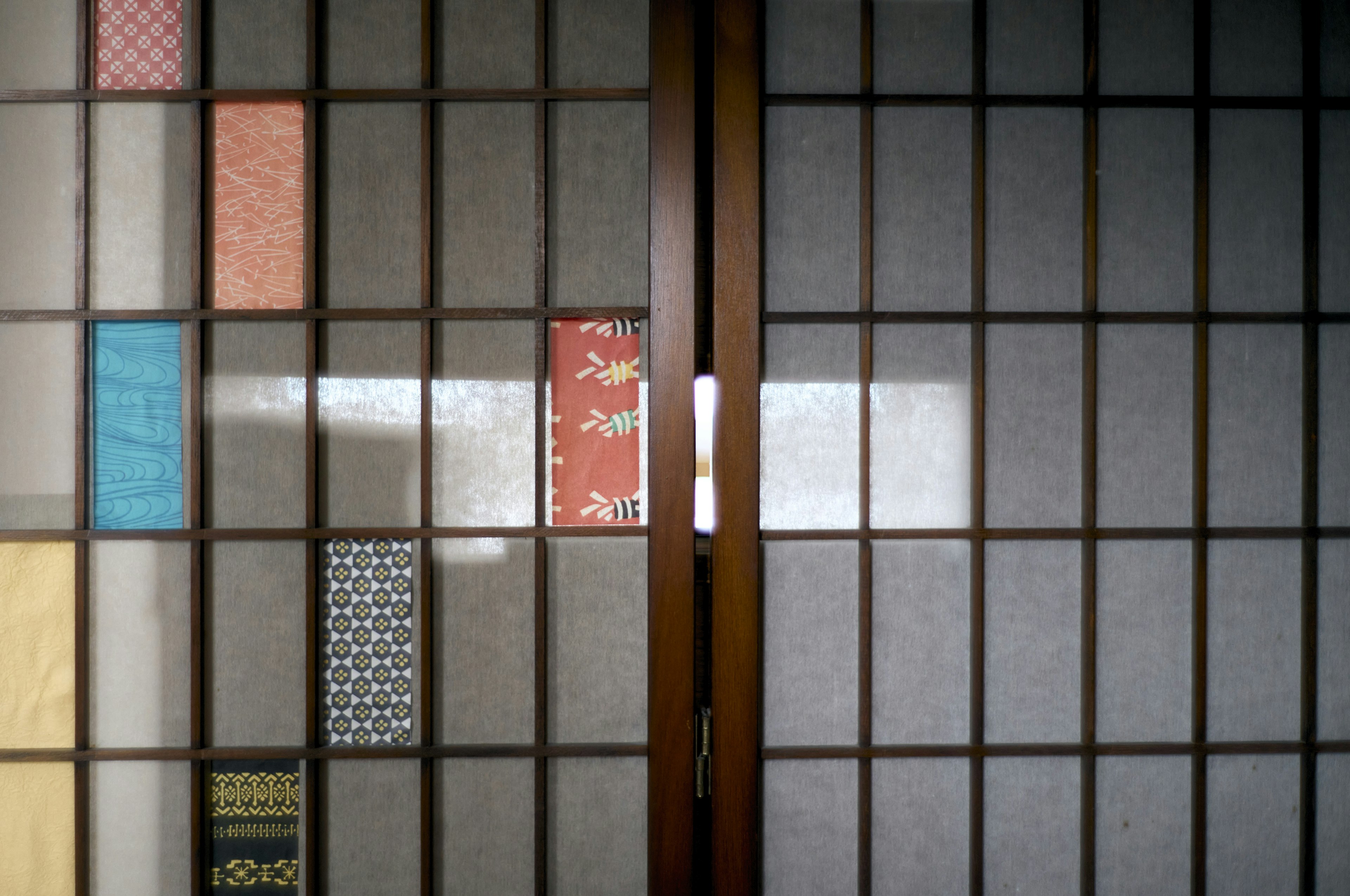 Japanese shoji screen with colorful patterned decorations