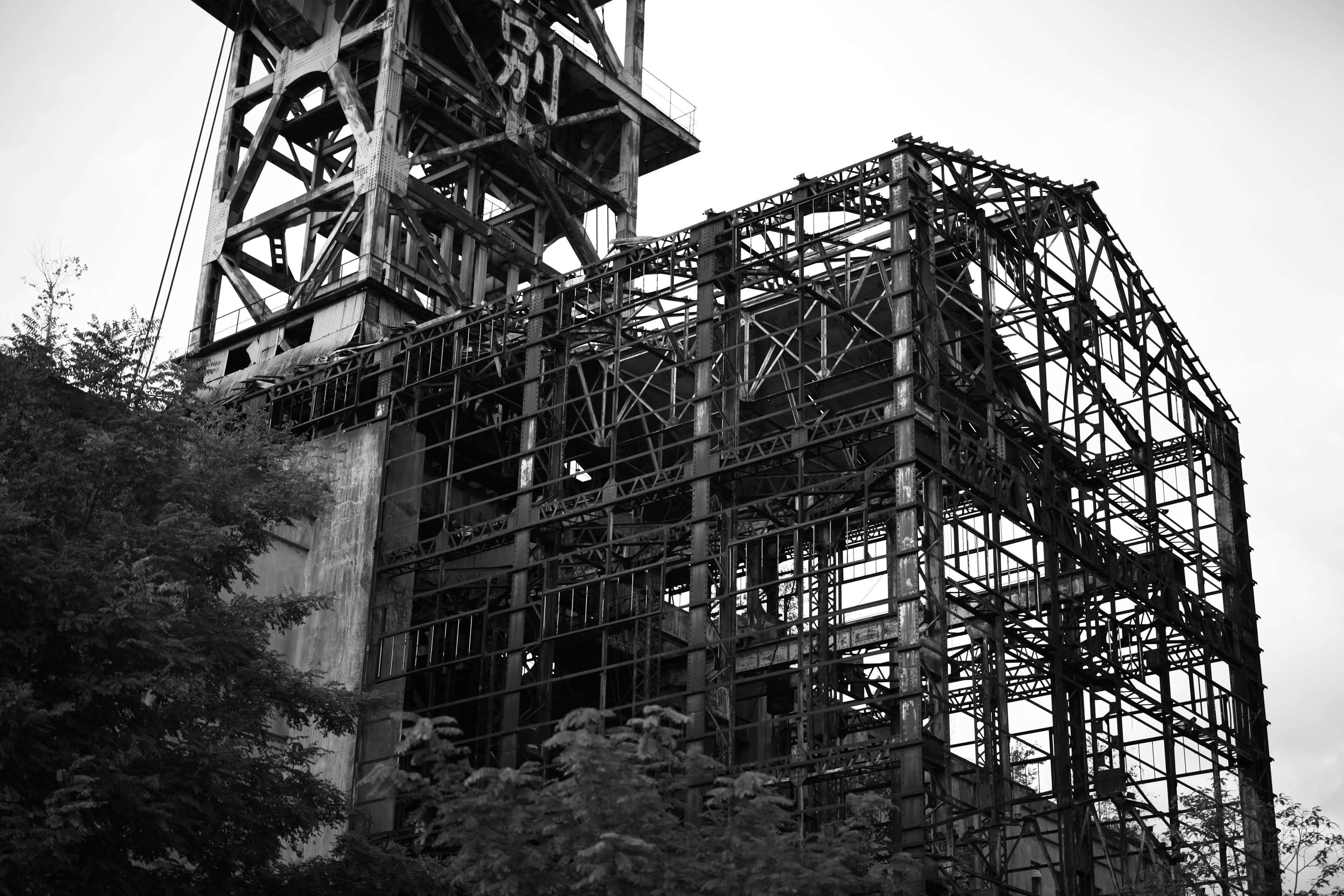 Black and white industrial building structure with steel framework