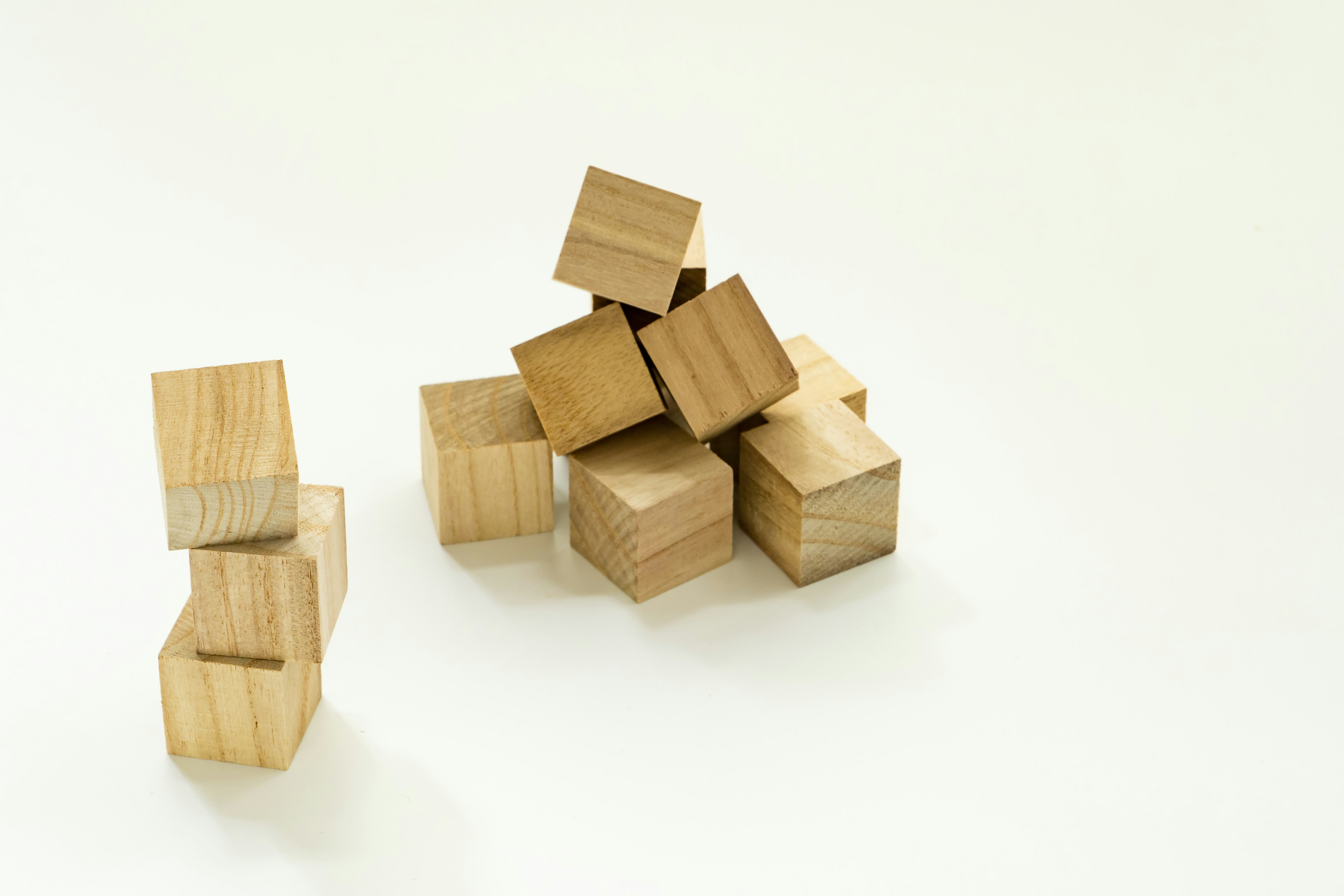 Wooden cubes stacked on a white background