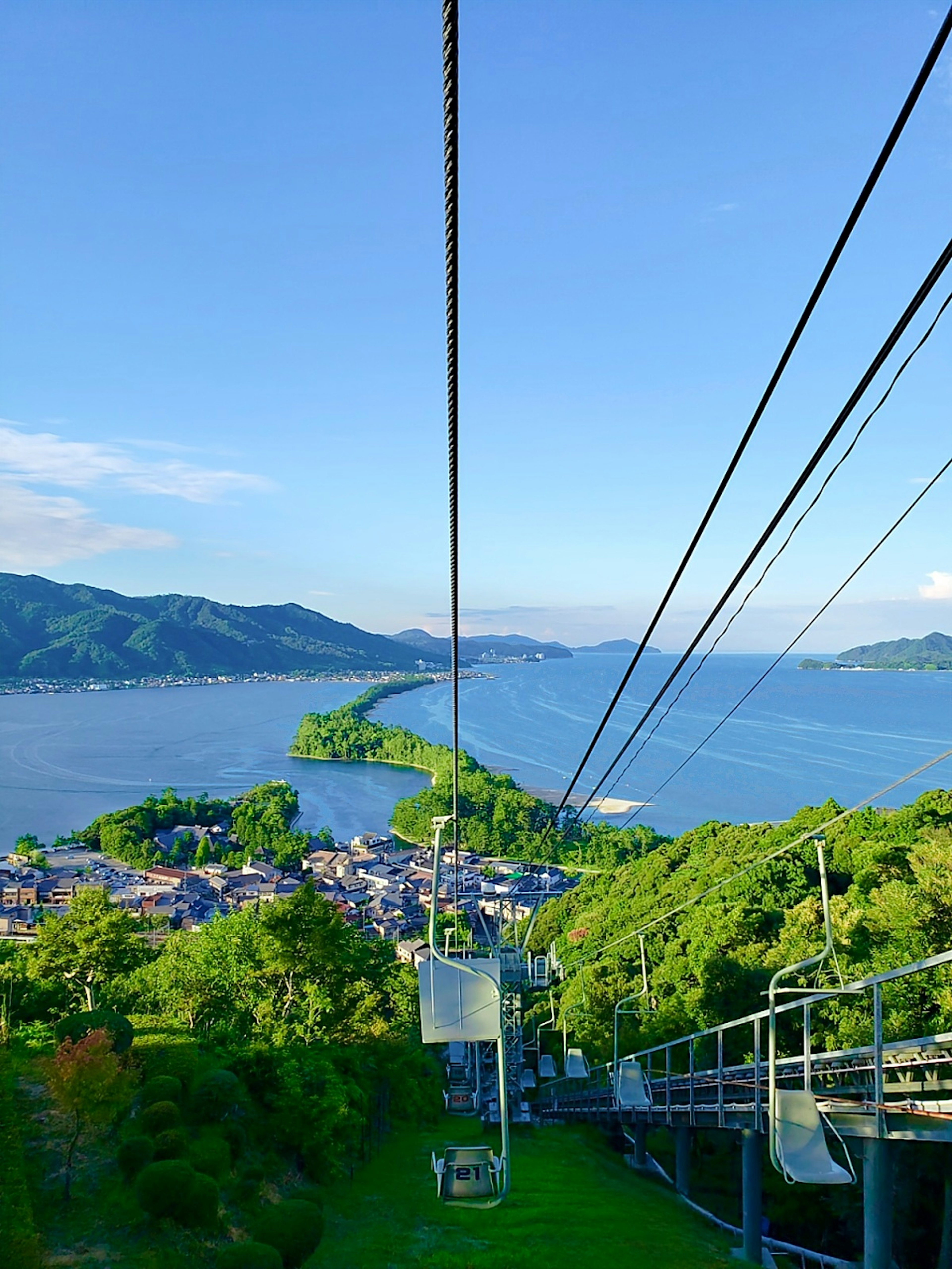 View of a cable car with stunning sea and mountain scenery