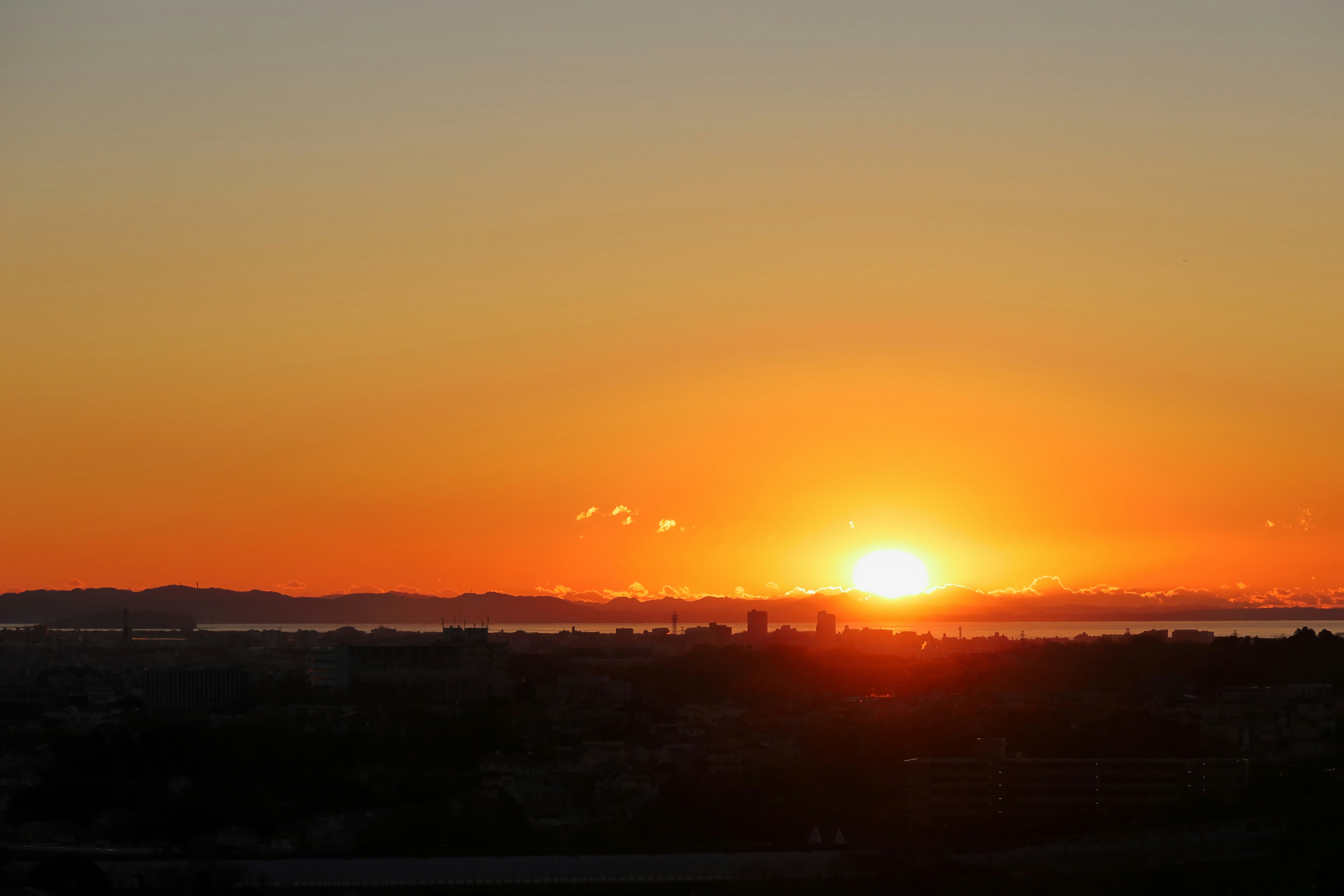 Beautiful sunset over the horizon skies transitioning from orange to yellow