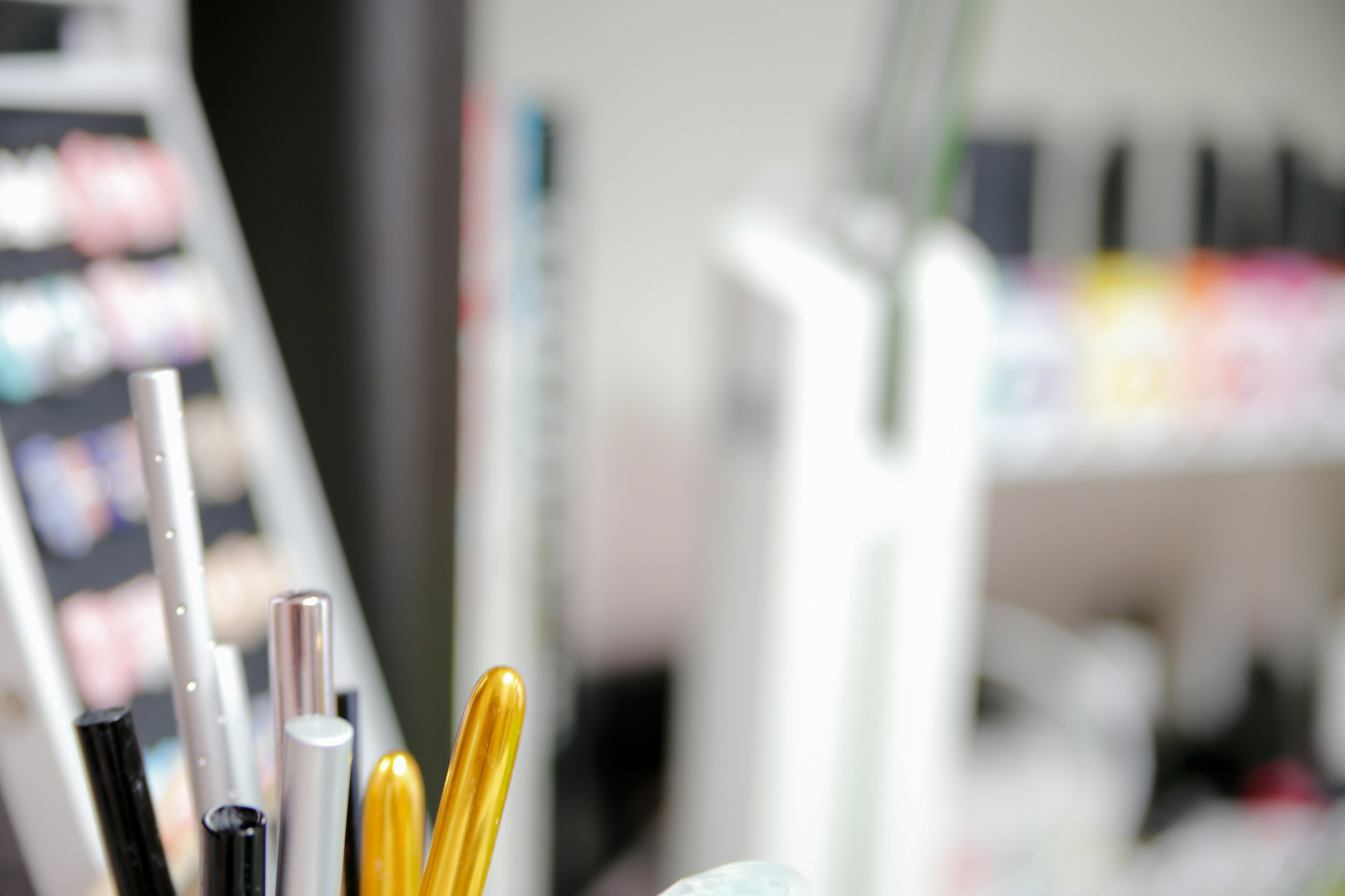 Close-up of colorful pens and stationery on a desk