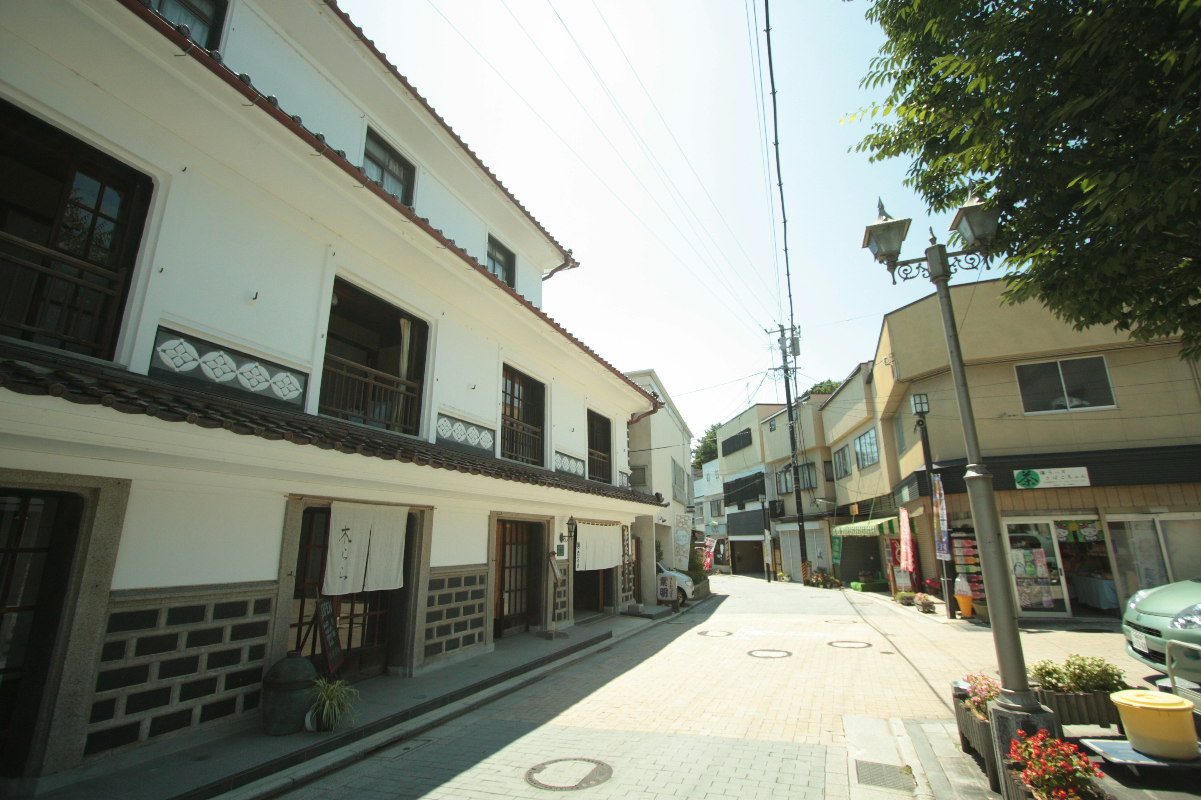 Quiet street scene featuring a mix of old and modern buildings