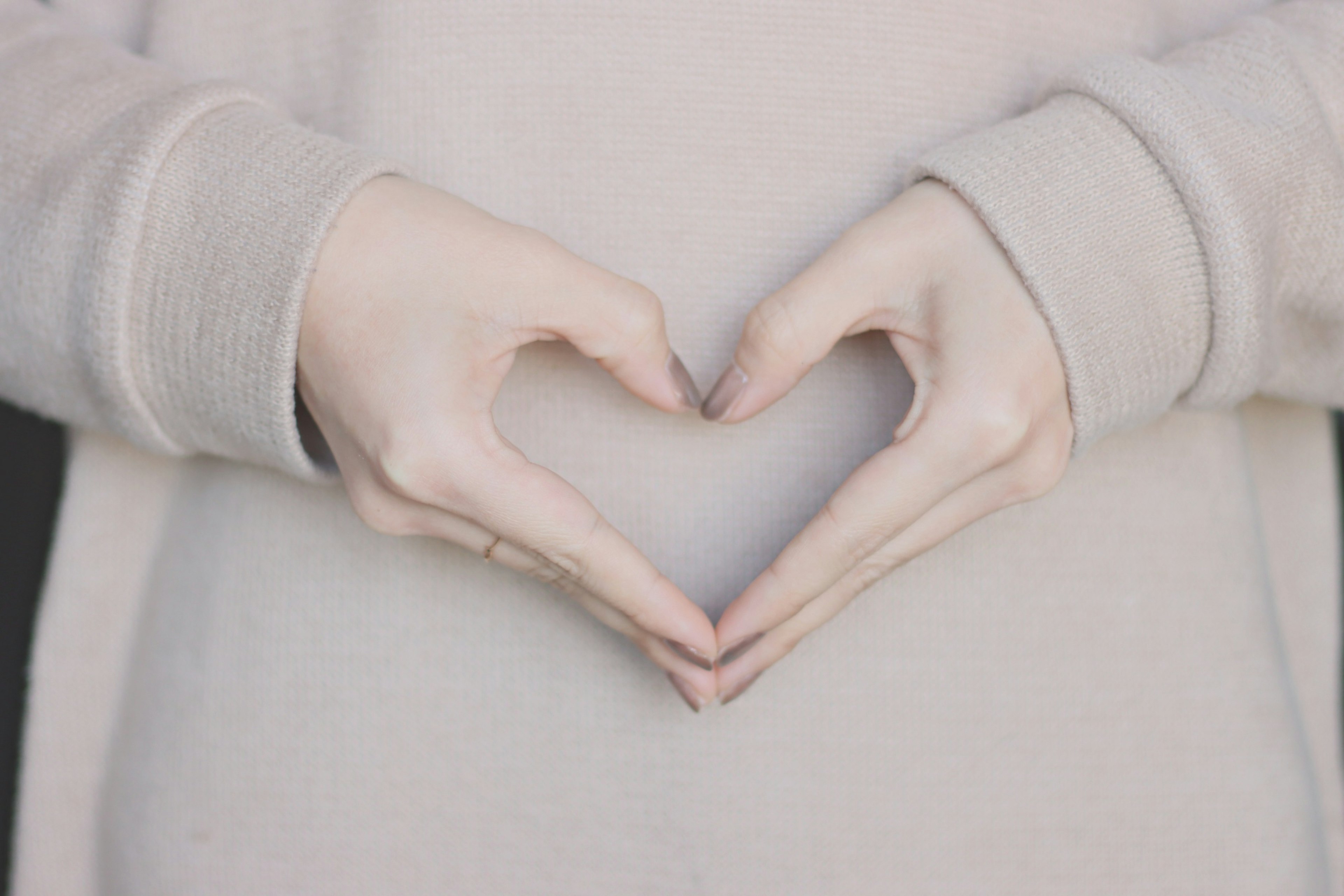 Hands forming a heart shape gesture