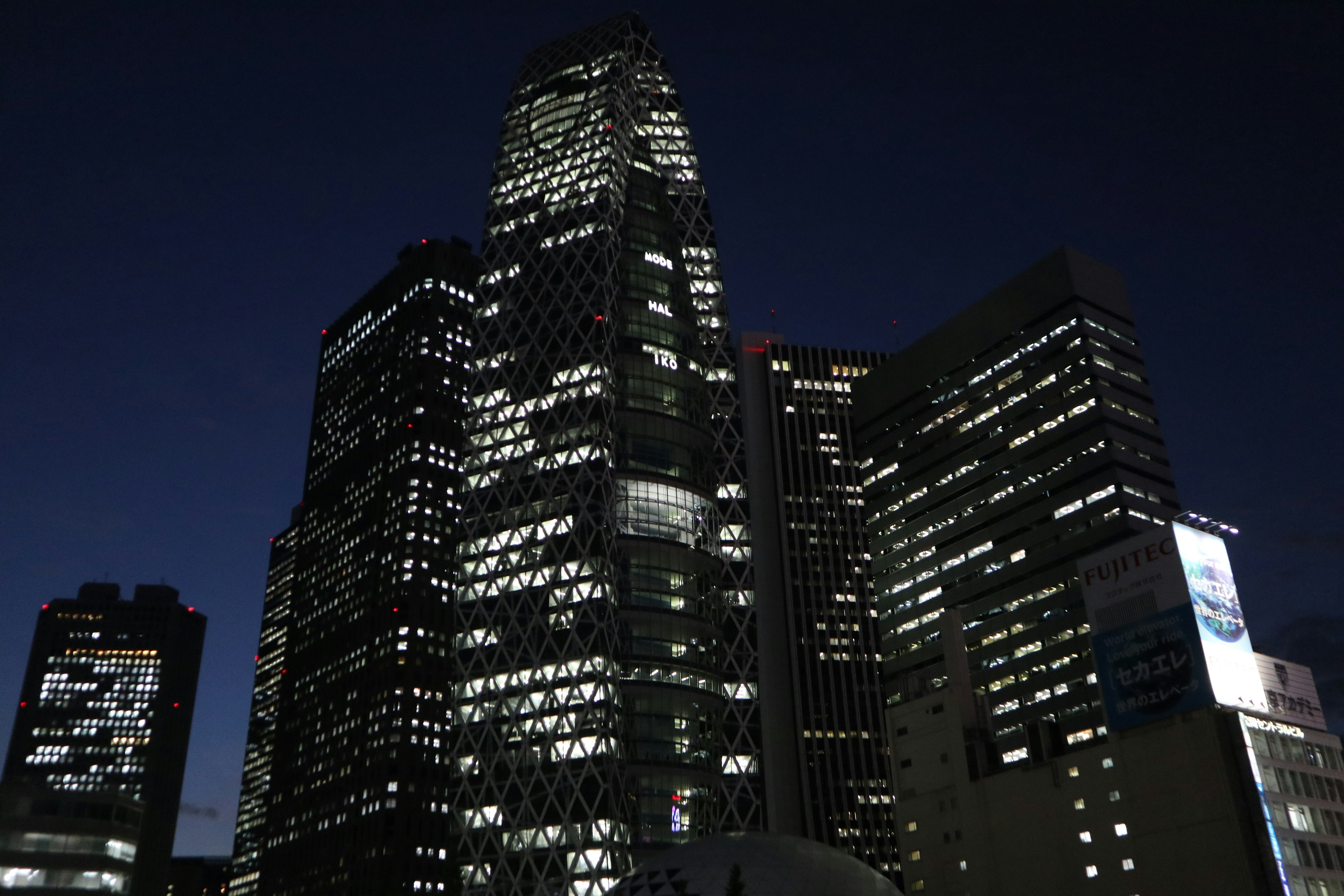 Night cityscape with illuminated skyscrapers