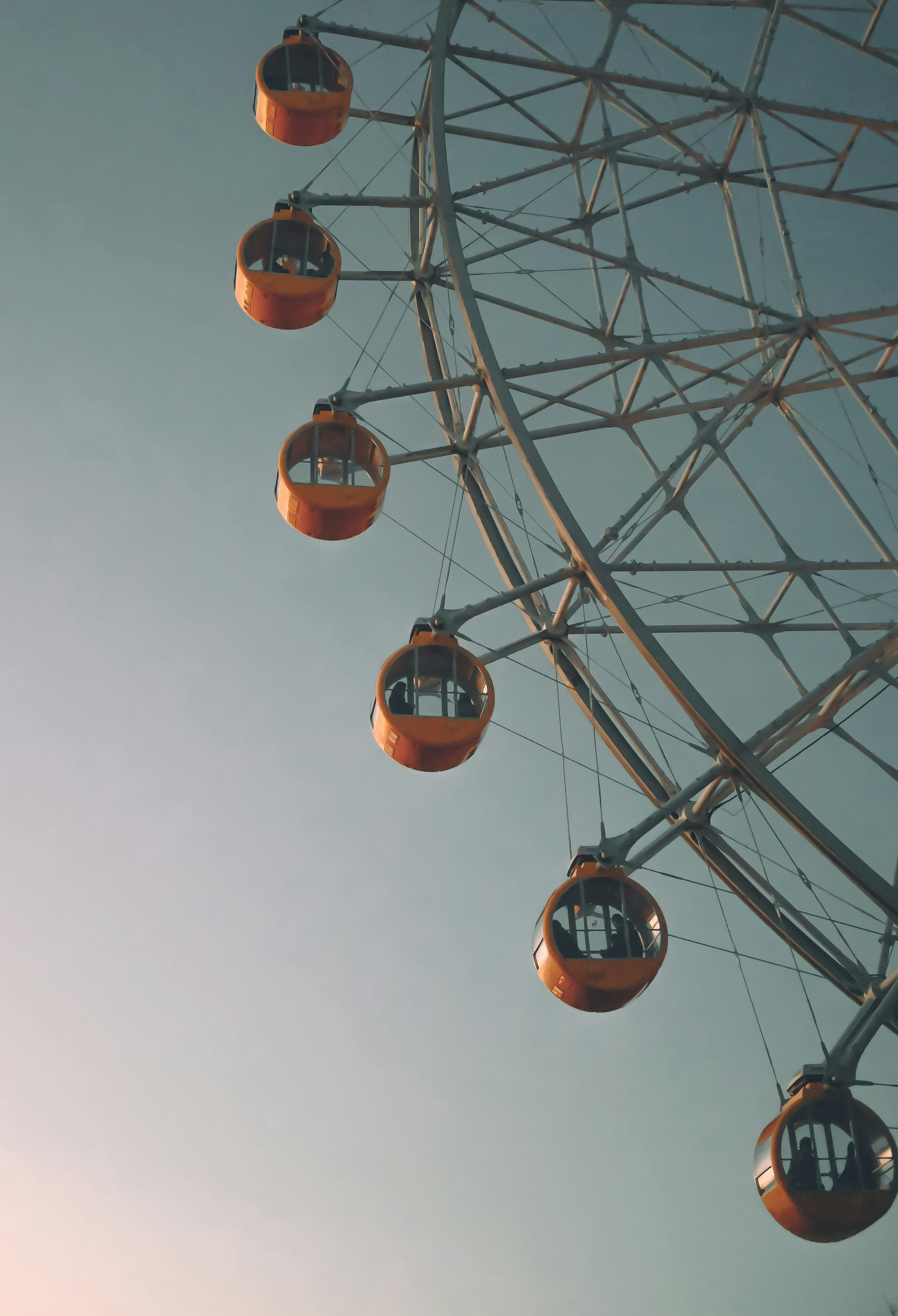 Ferris wheel cabins against a clear sky