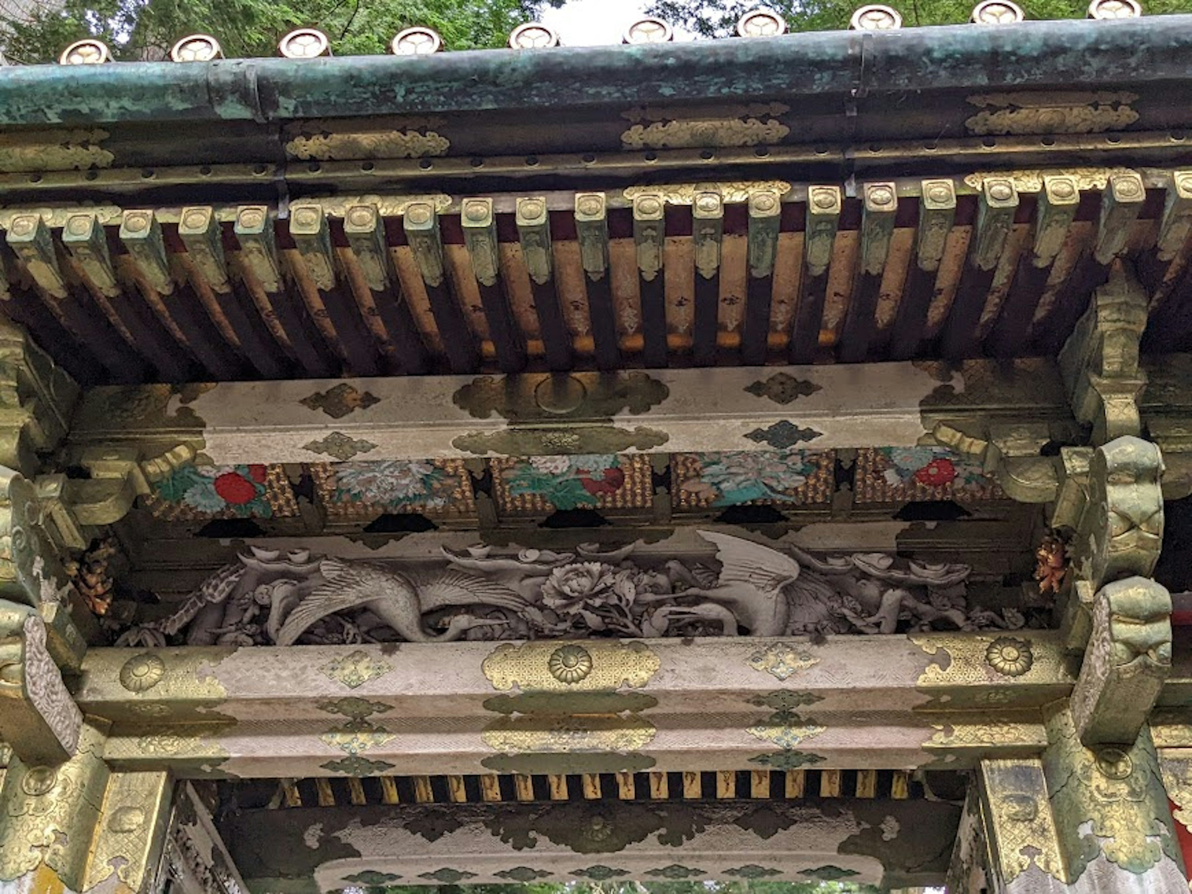 Traditional building roof adorned with colorful carvings and intricate details