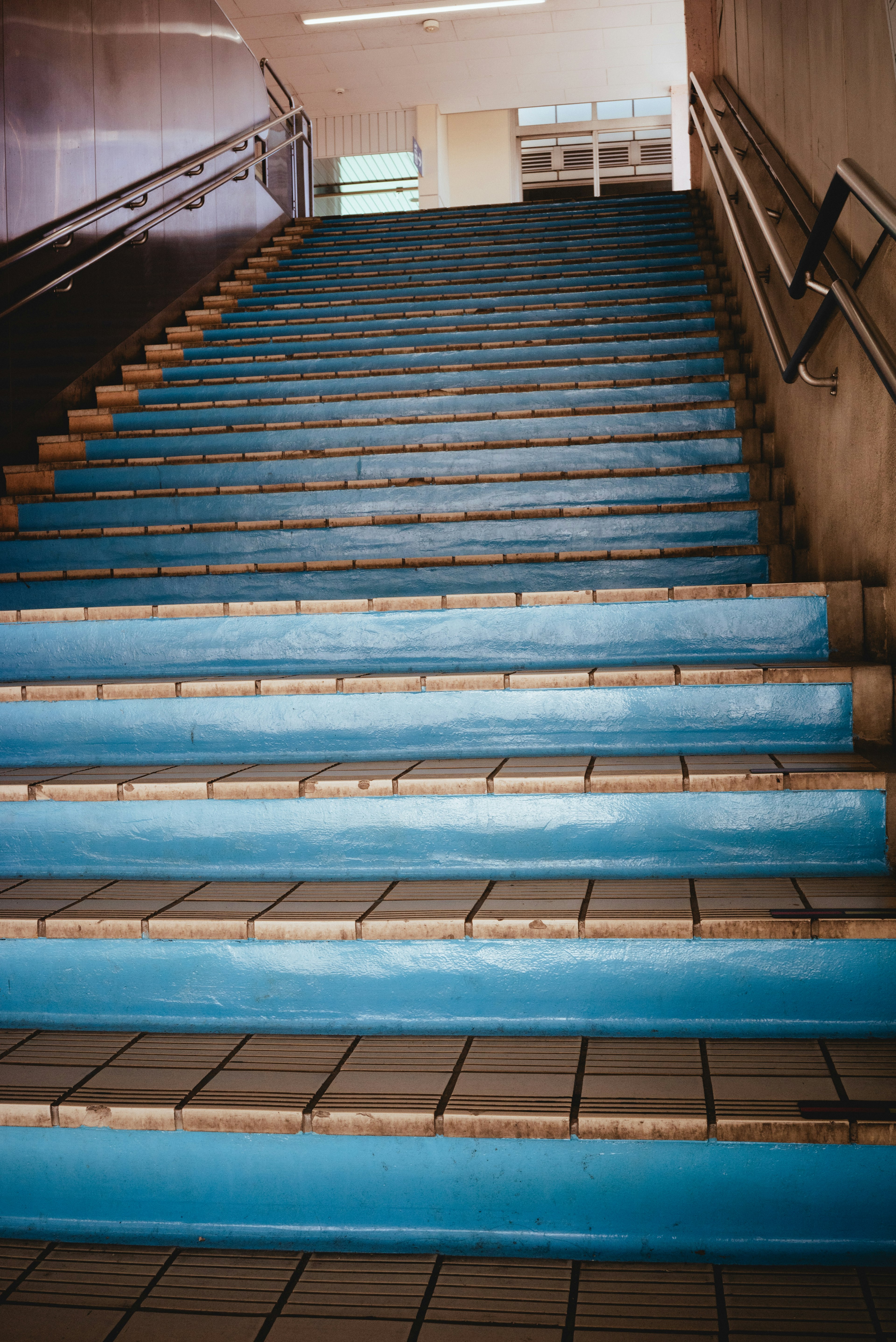 Bright space featuring blue stairs