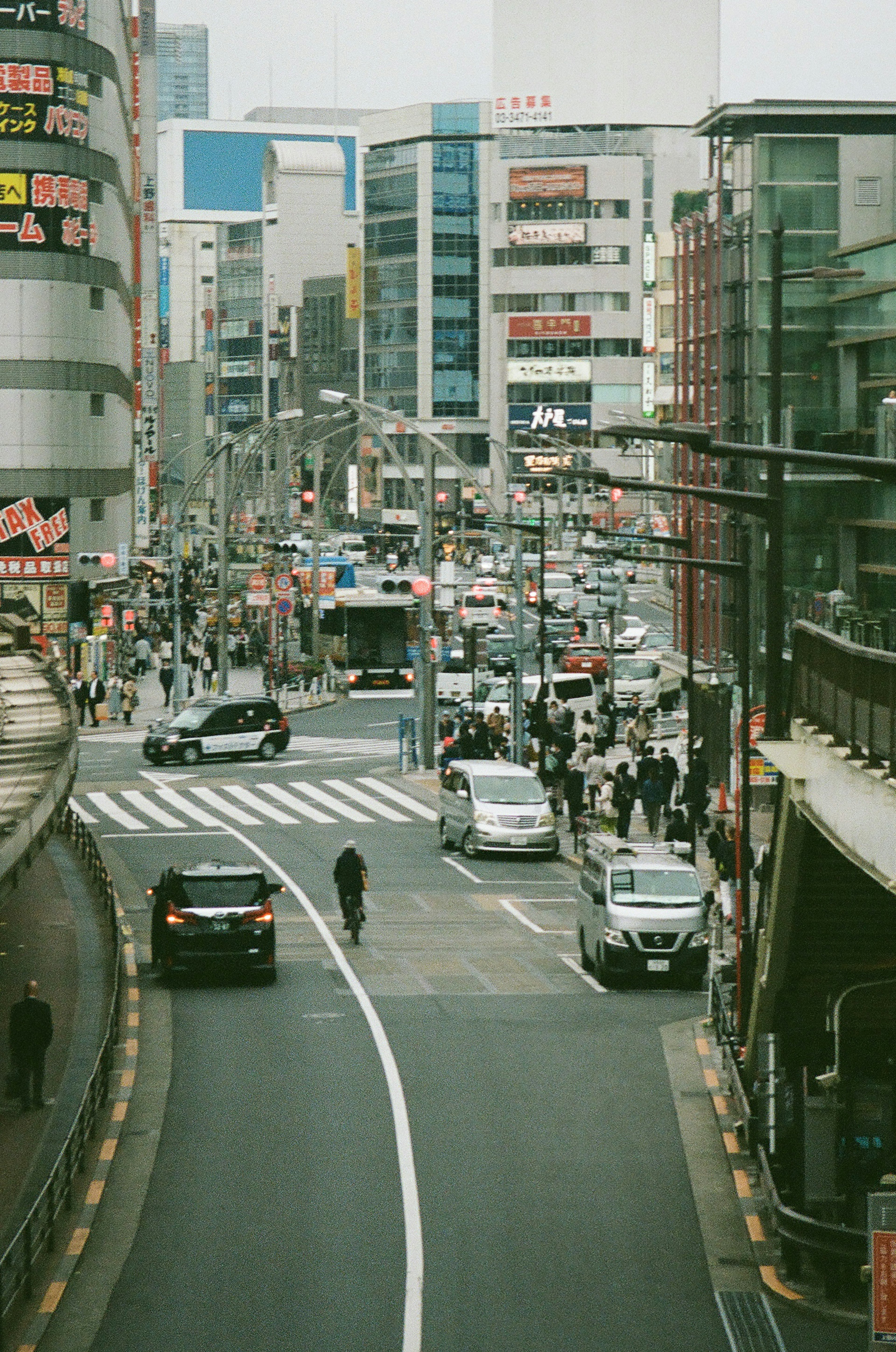 Busy urban intersection with pedestrians and vehicles