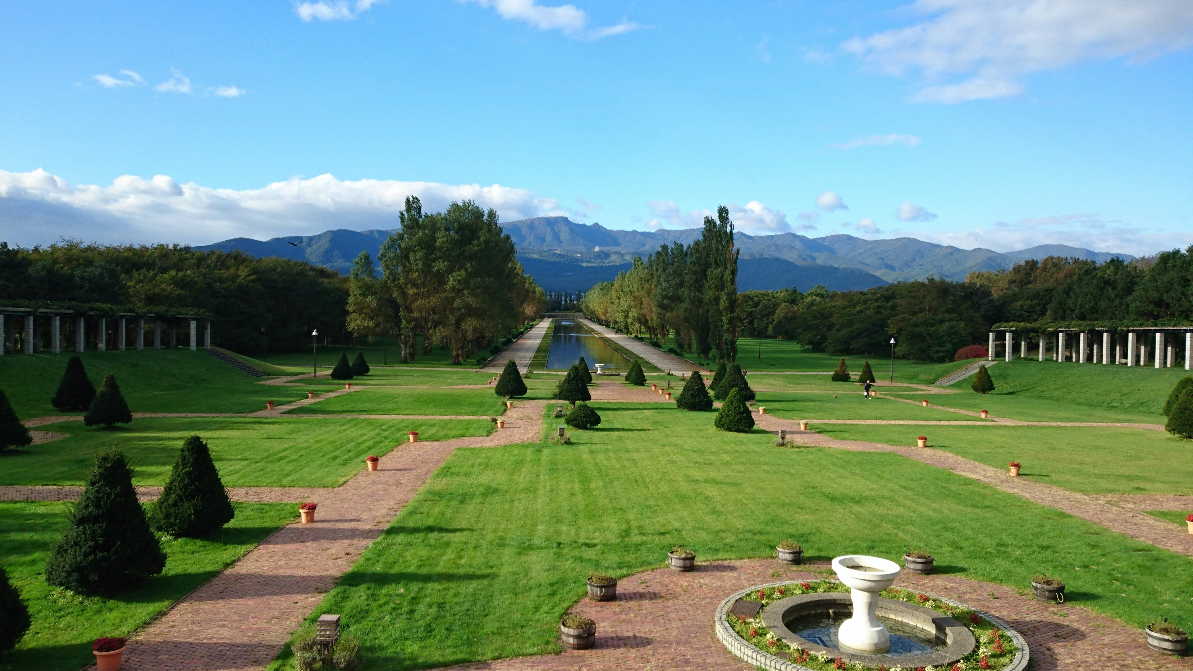 A beautiful view of a spacious garden with well-maintained lawns