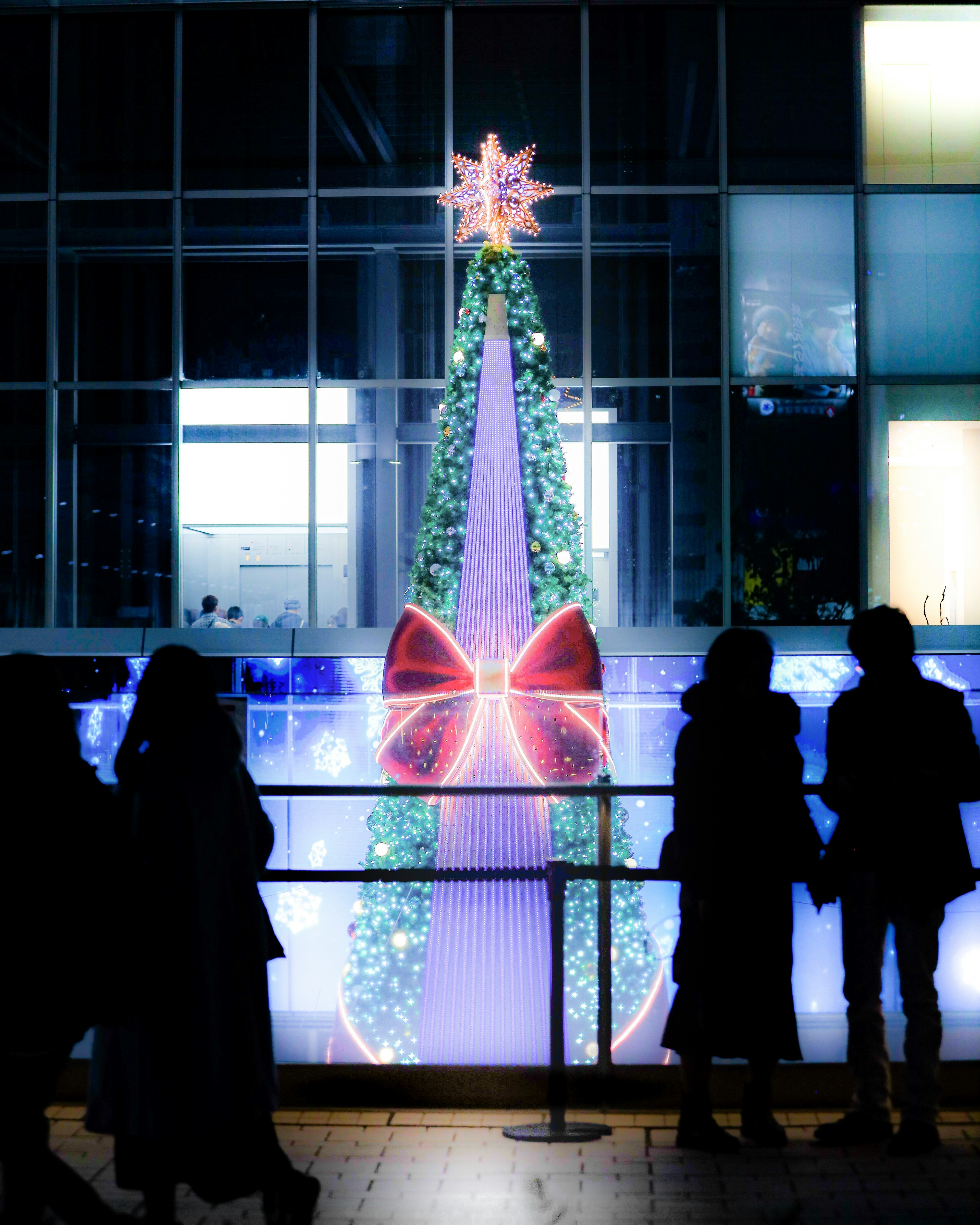 Christmas tree decoration with silhouettes of people