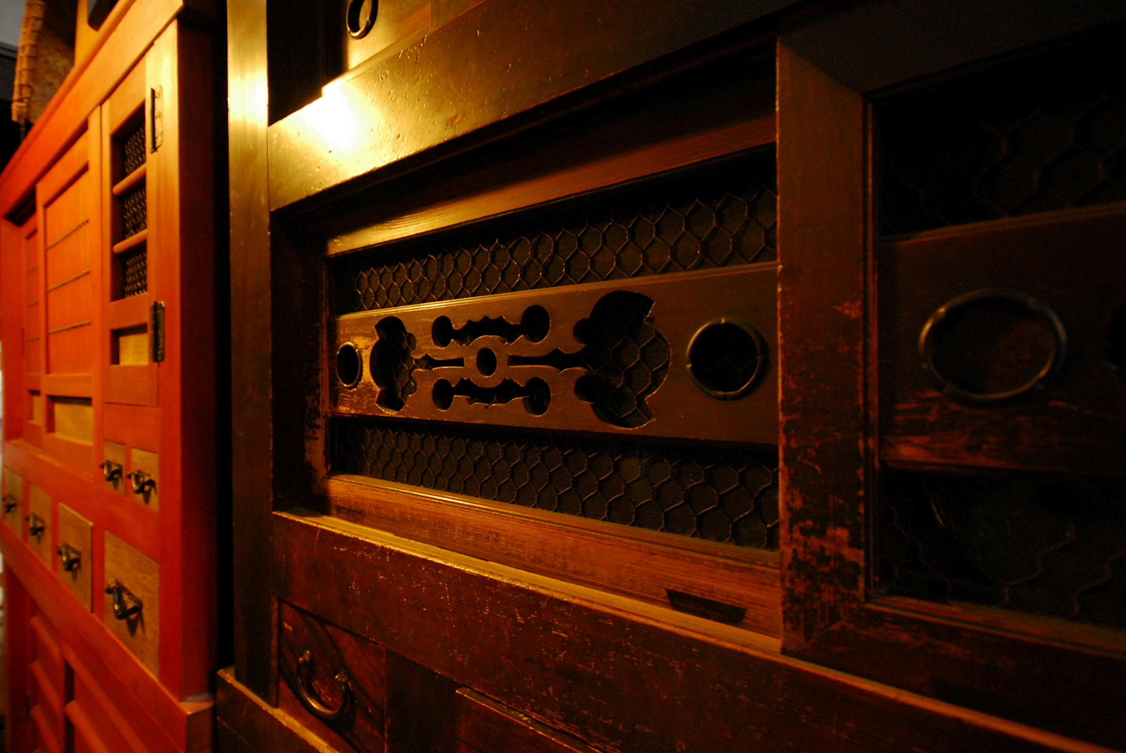 Interior of a wooden chest with decorative drawers