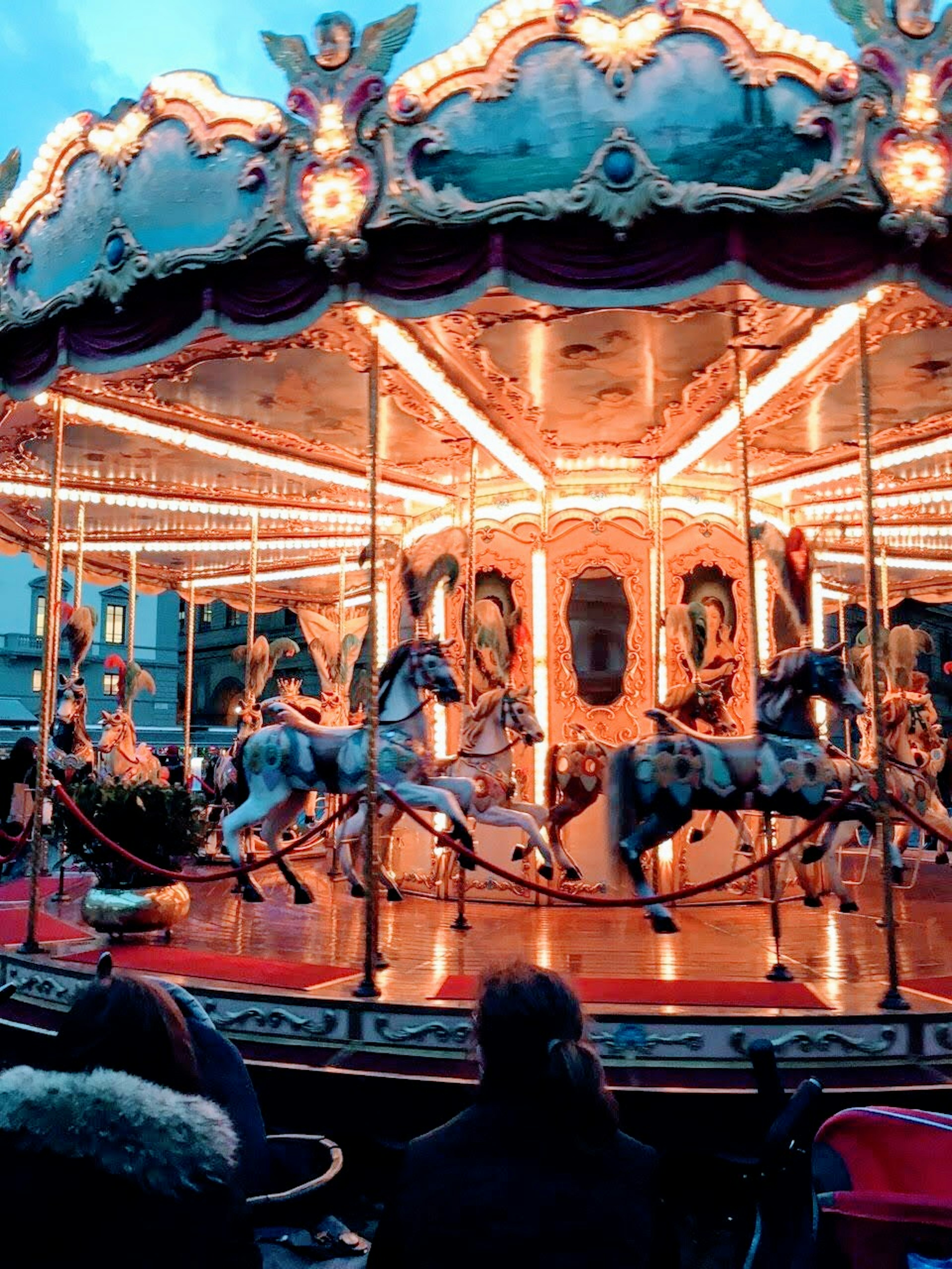 Colorful carousel illuminated with bright lights