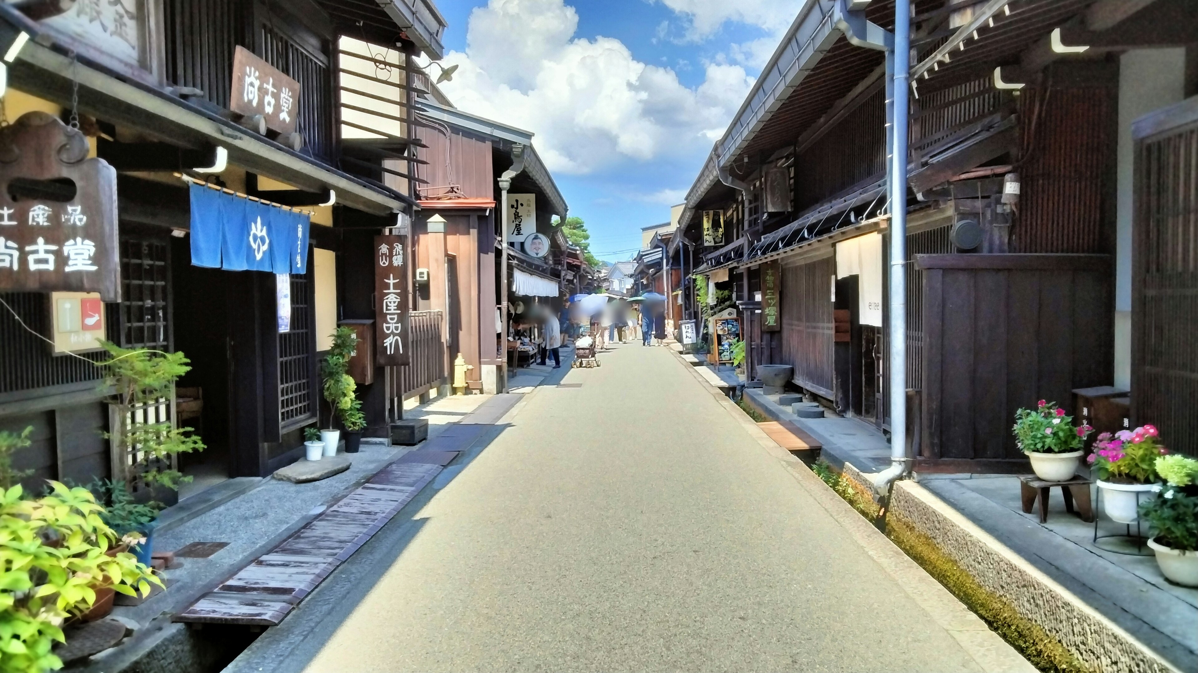 Quiet street lined with traditional Japanese shops