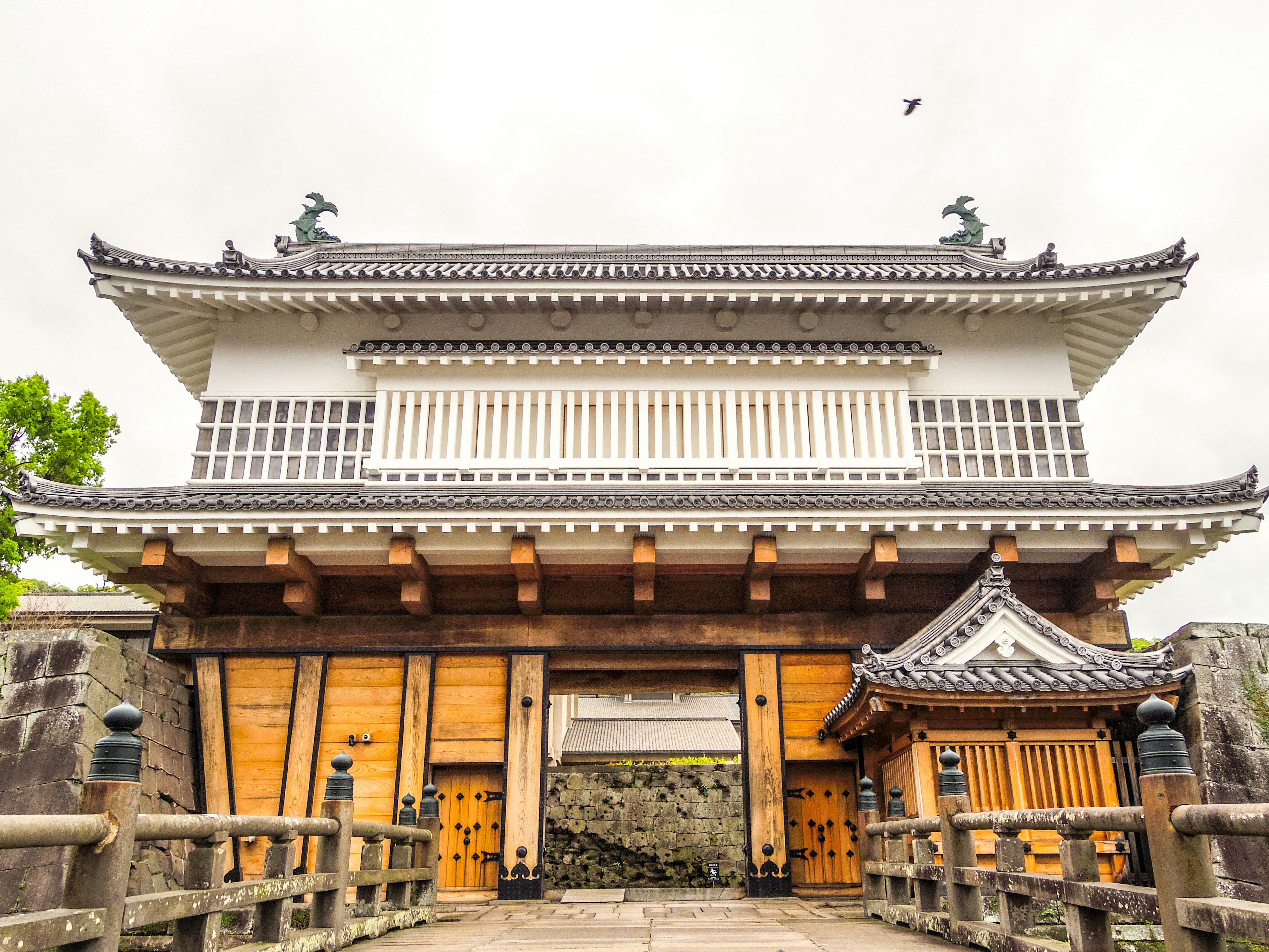 Historic Japanese gate with wooden bridge