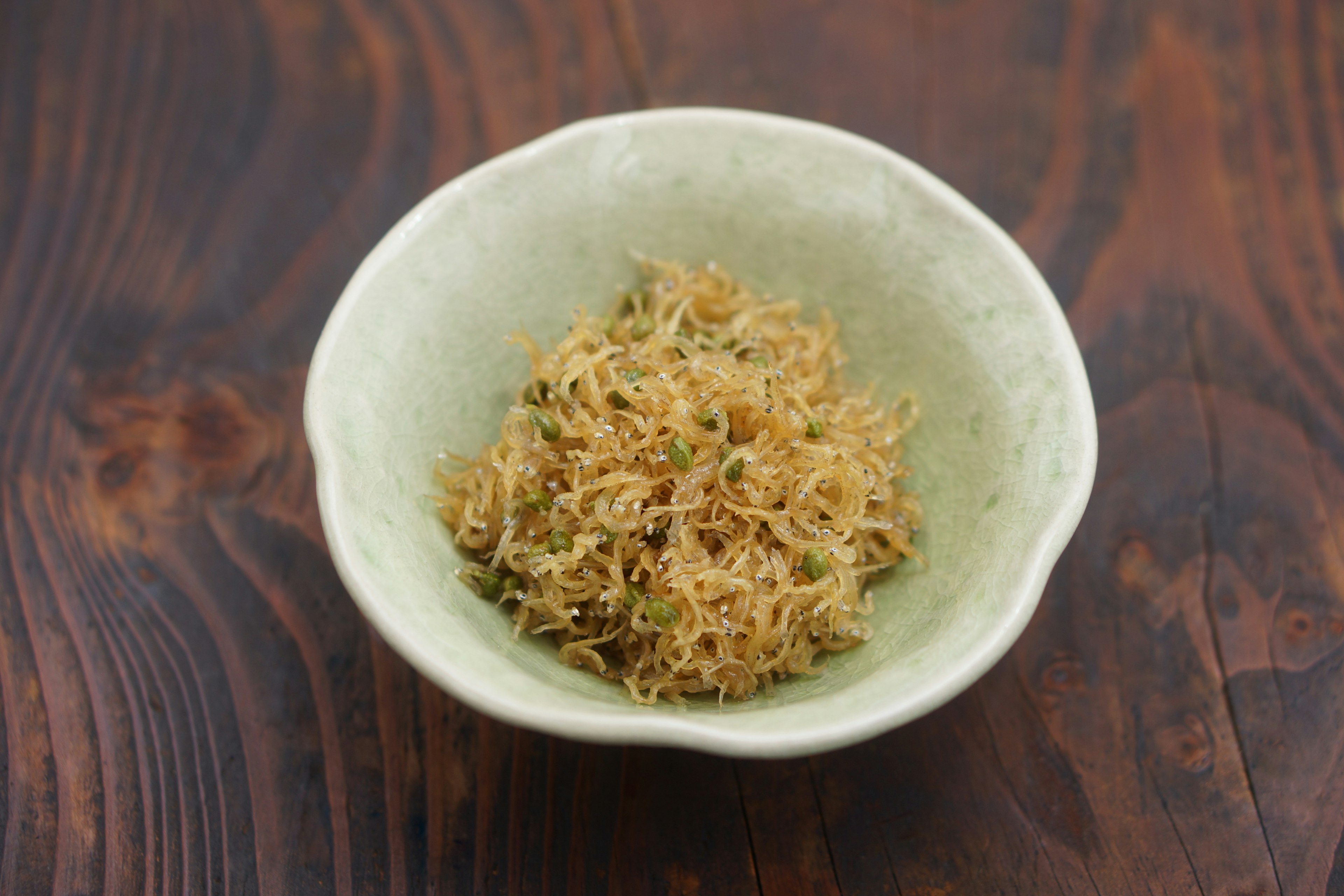 Dish of finely shredded dried shrimp in a green bowl