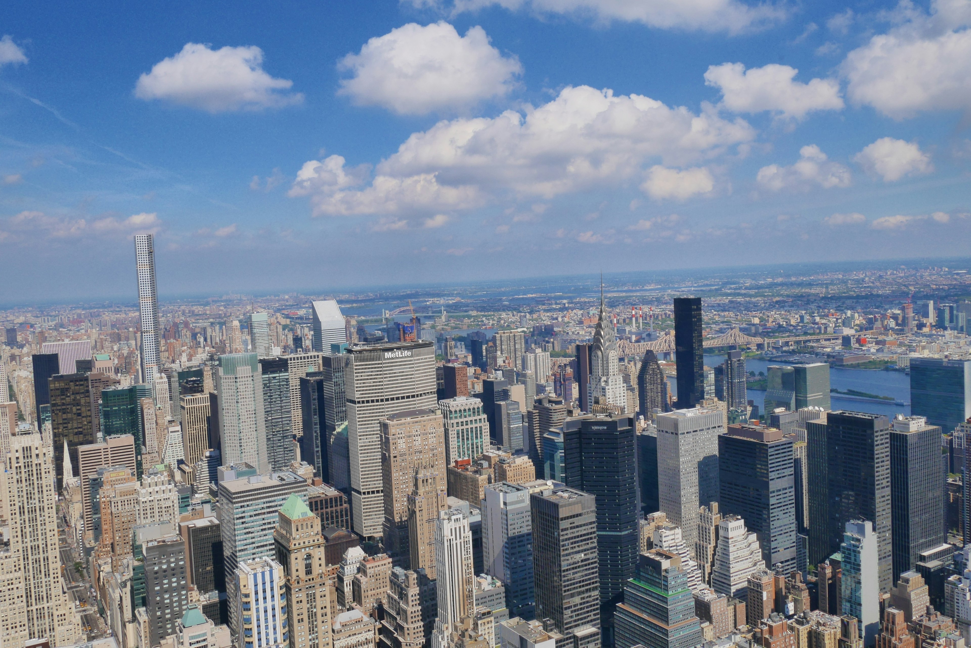 Panoramic view of New York City skyline with blue sky