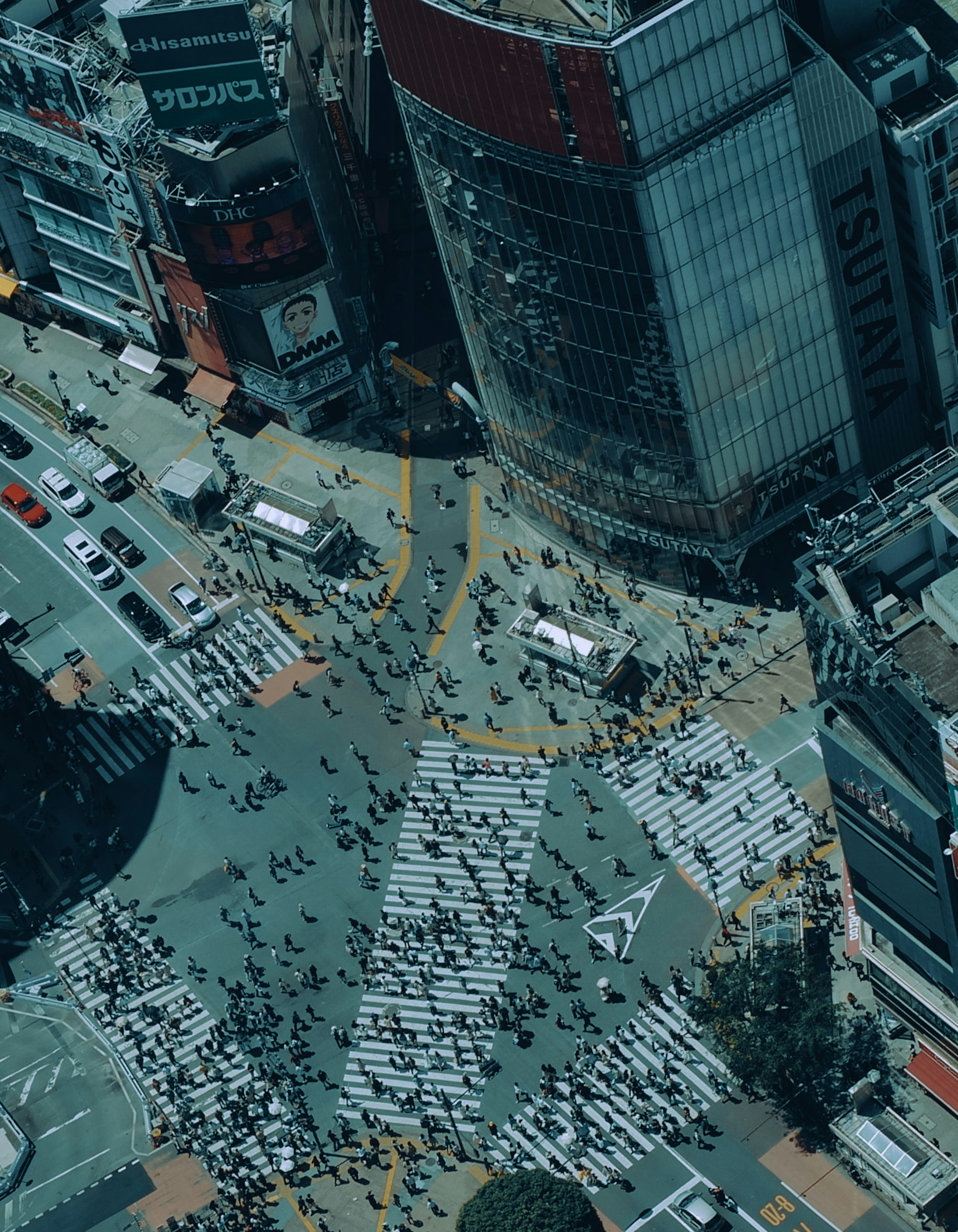 Aerial view of Shibuya Crossing with bustling crowds and cityscape